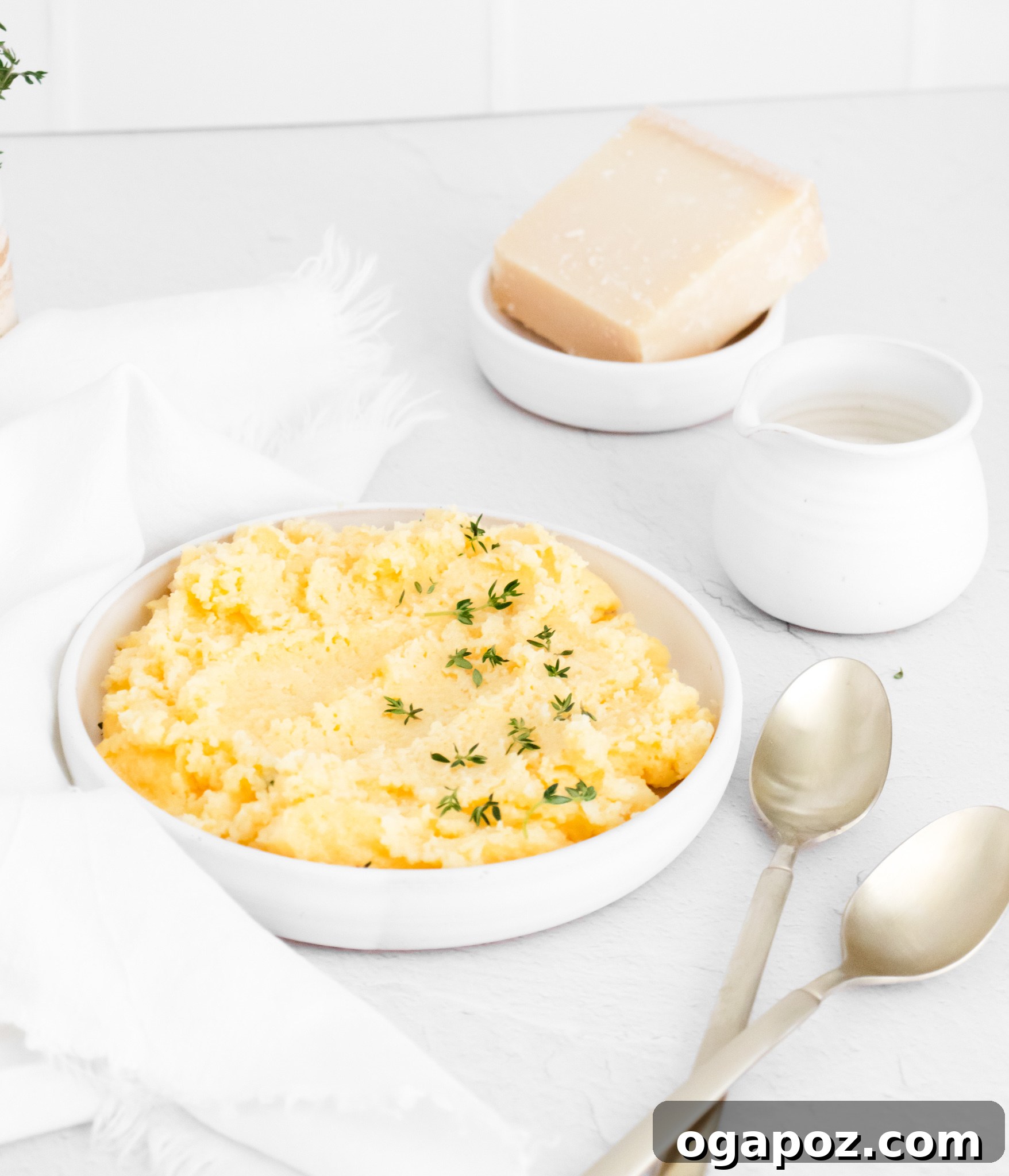Dreamy Creamy Polenta 4 Ingredients for creamy polenta laid out, including polenta, cheese, and butter.
