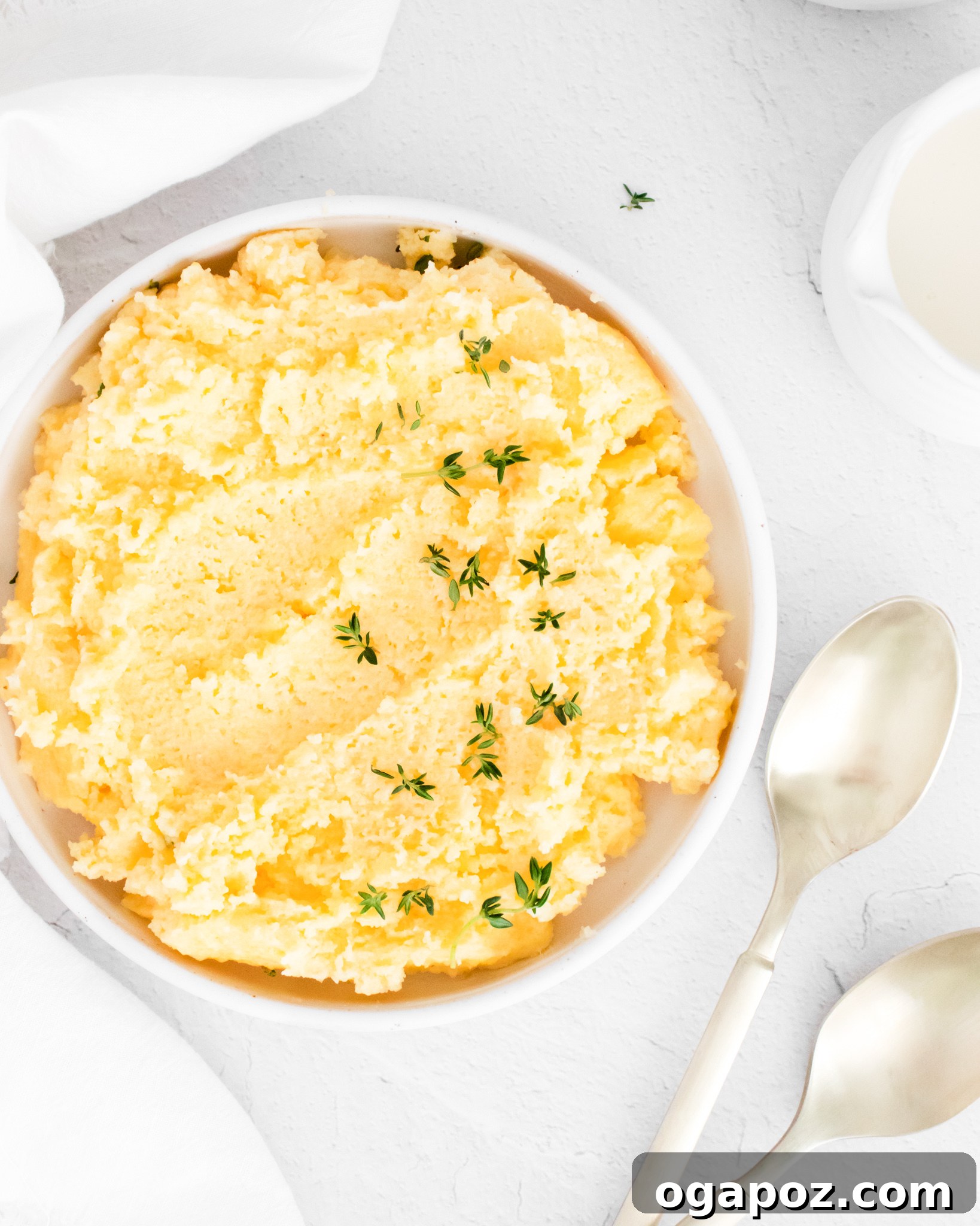 Dreamy Creamy Polenta 6 Serving of creamy polenta with spoons, ready to be enjoyed.