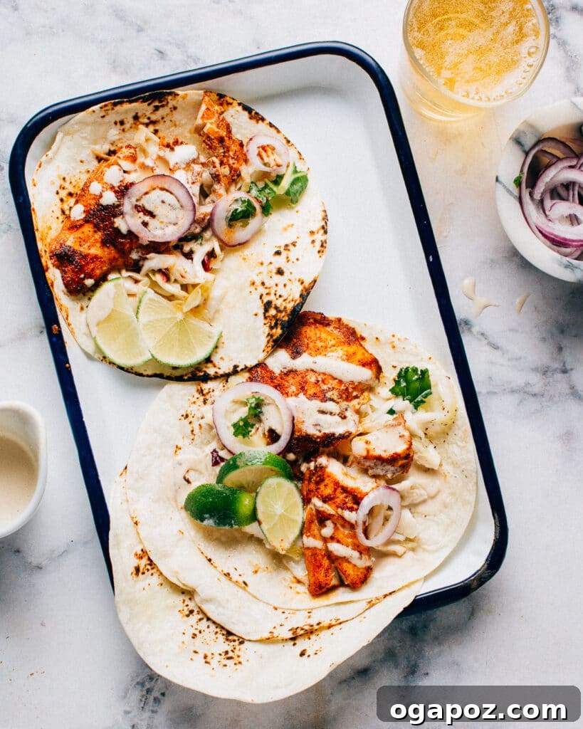 Halibut Perfection: Recipes You'll Adore 2 Spicy Fish Tacos with Lime Crema featuring flaky halibut and zesty slaw, a popular and easy weeknight meal.