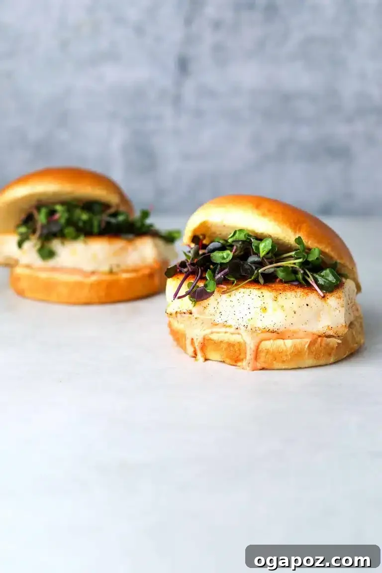Halibut Perfection: Recipes You'll Adore 15 Homemade halibut burgers served on buns with spicy sriracha aioli, a fun and quick meal idea.