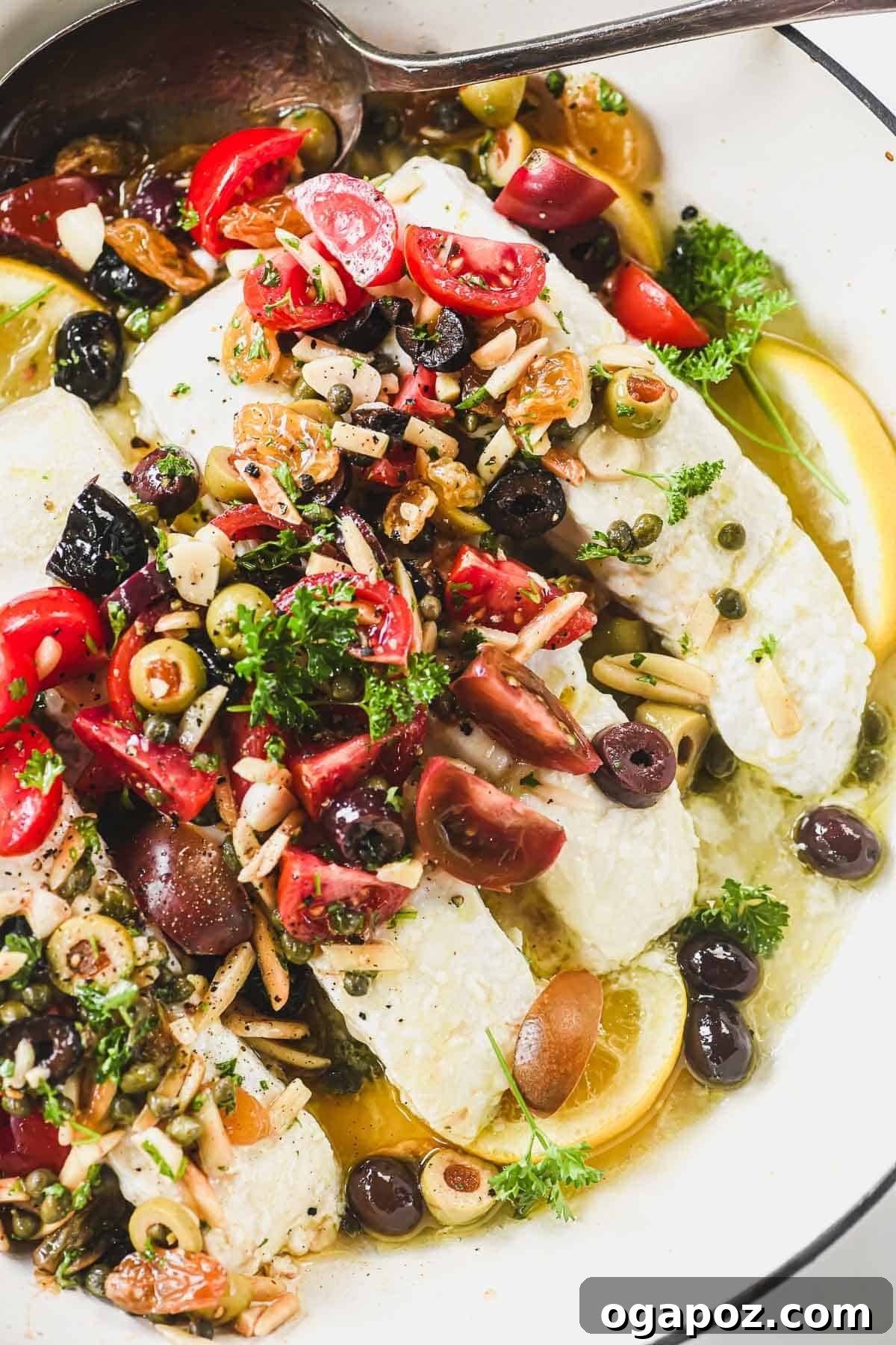 Halibut Perfection: Recipes You'll Adore 16 Sicilian baked halibut with sweet raisins, crunchy almonds, and anchovy paste, bursting with Mediterranean flavors.