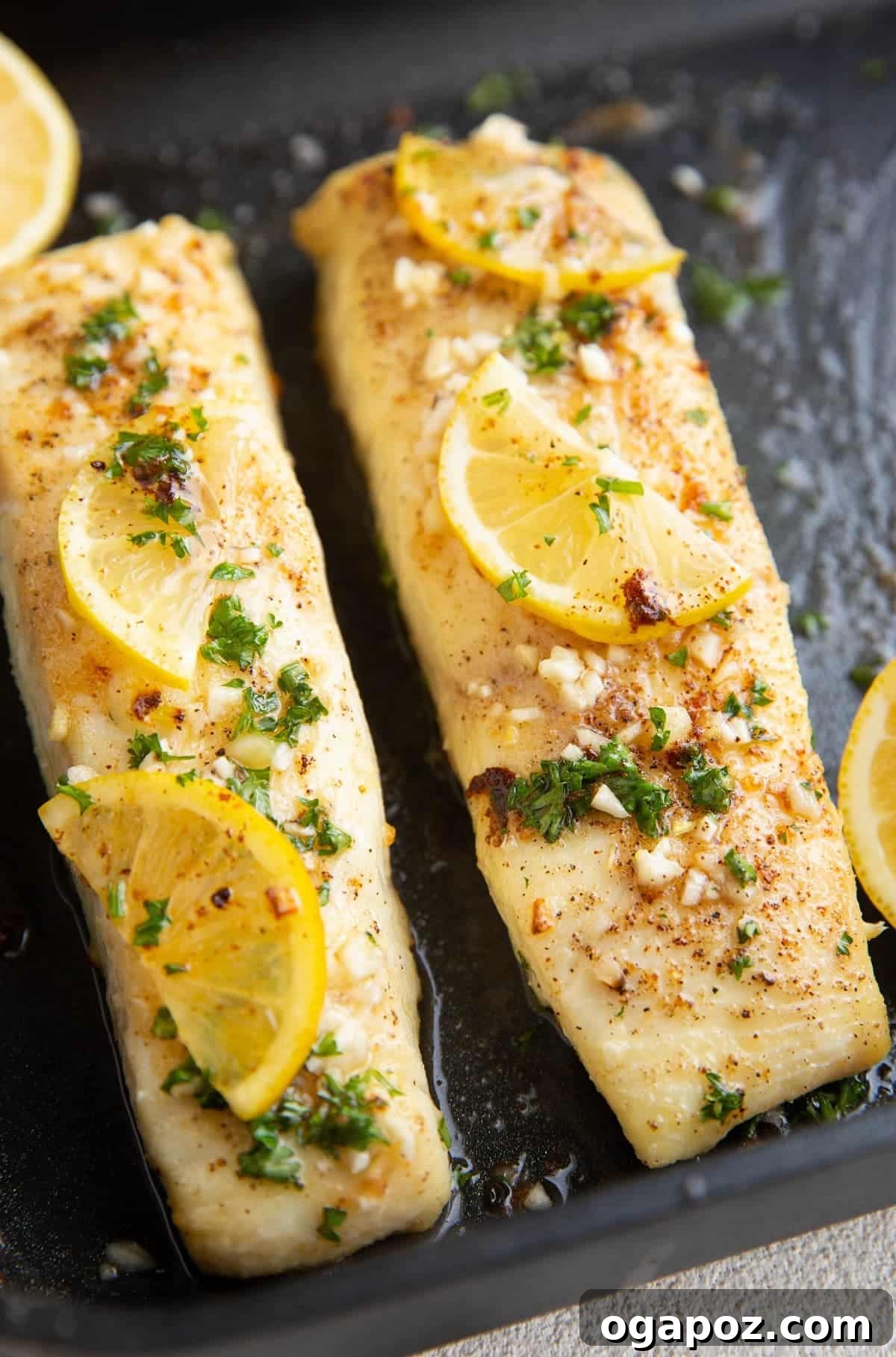 Halibut Perfection: Recipes You'll Adore 6 Perfectly baked halibut fillets infused with rich garlic butter, ready for a quick and satisfying dinner.