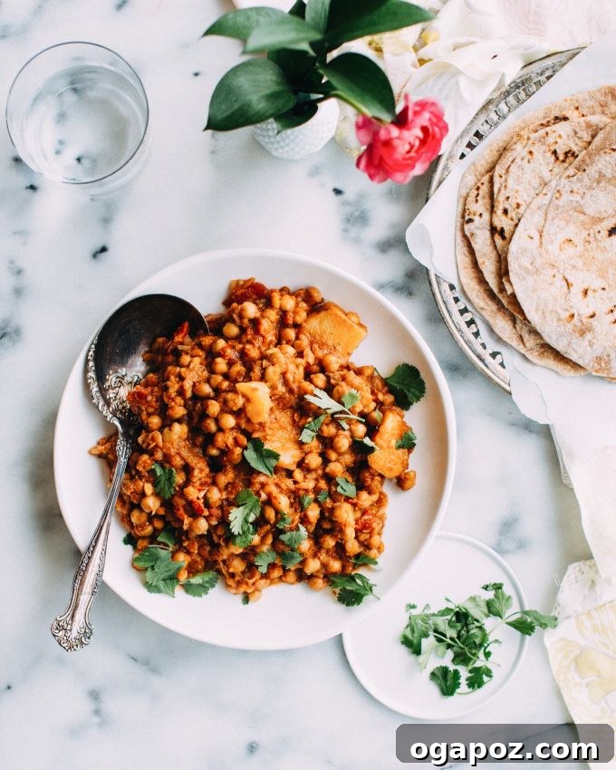 Quick & Flavorful: 14+ Instant Pot Indian Recipes You'll Adore 2 Flavorful chickpea curry served with fluffy roti.