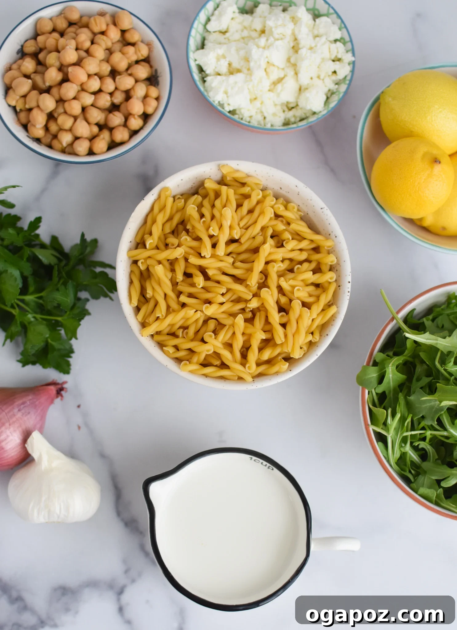 Mediterranean Chickpea Feta Pasta 3 Fresh ingredients for Chickpea Pasta with Feta, including lemon, milk, feta, and spices.