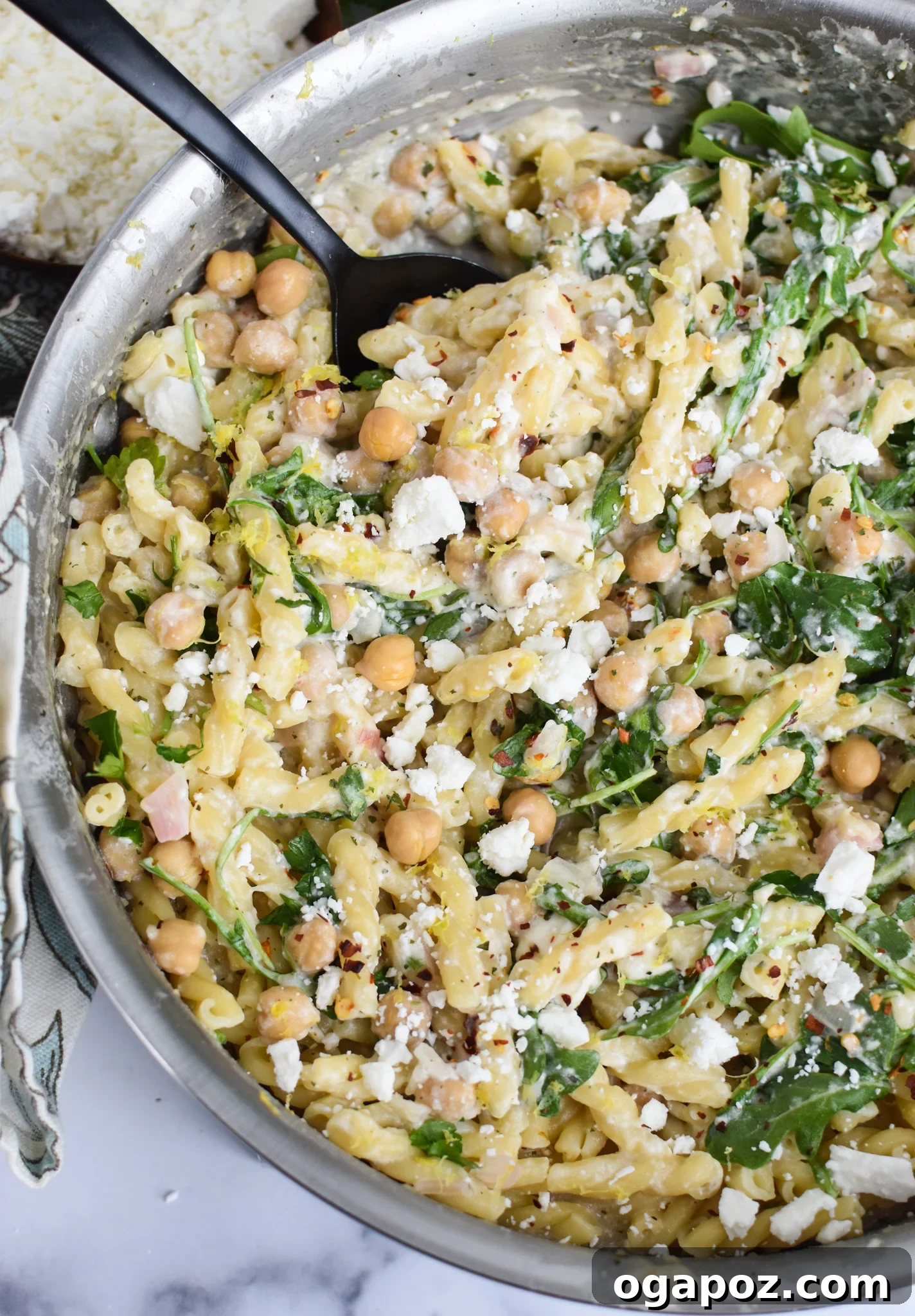 Mediterranean Chickpea Feta Pasta 4 Chickpea Pasta Recipe with Feta being cooked in a pot, demonstrating the creamy sauce.