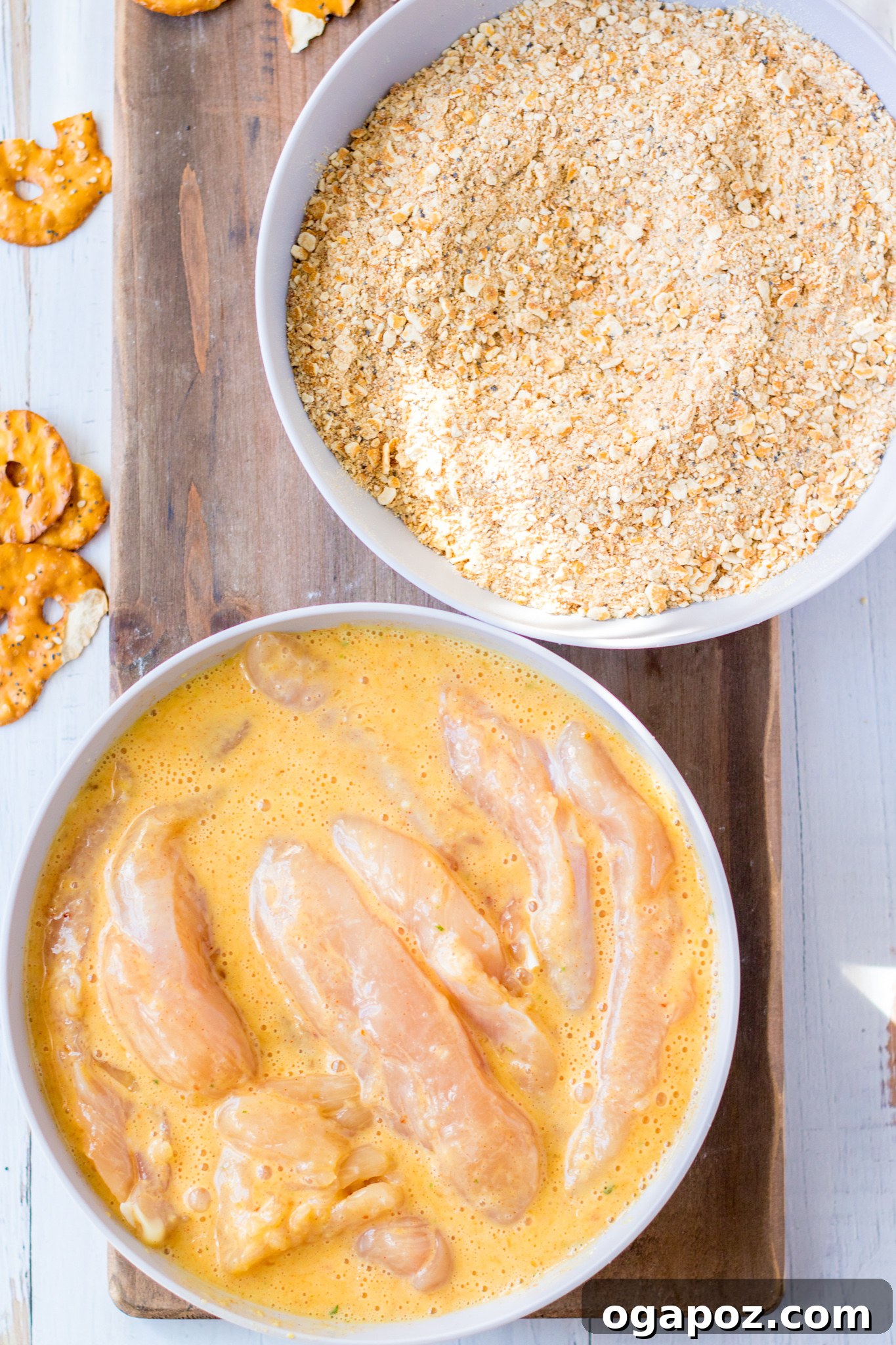 Crispy Pretzel Chicken Dinner 3 Various ingredients for Pretzel Crusted Chicken recipe laid out on a table, including chicken, pretzels, honey mustard, and spices.