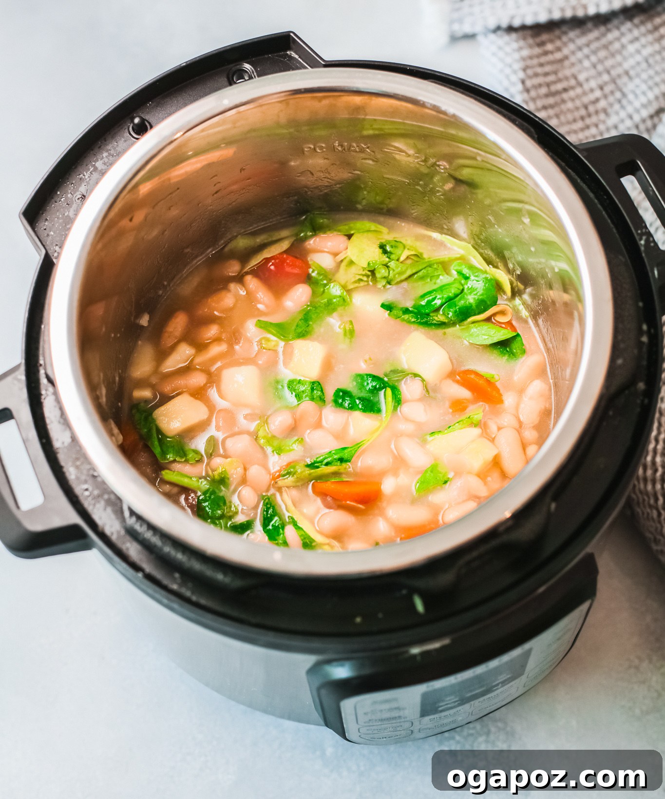 Instant Pot Bean Soup simmering gently in the Instant Pot, highlighting its rich texture and vibrant colors before serving.