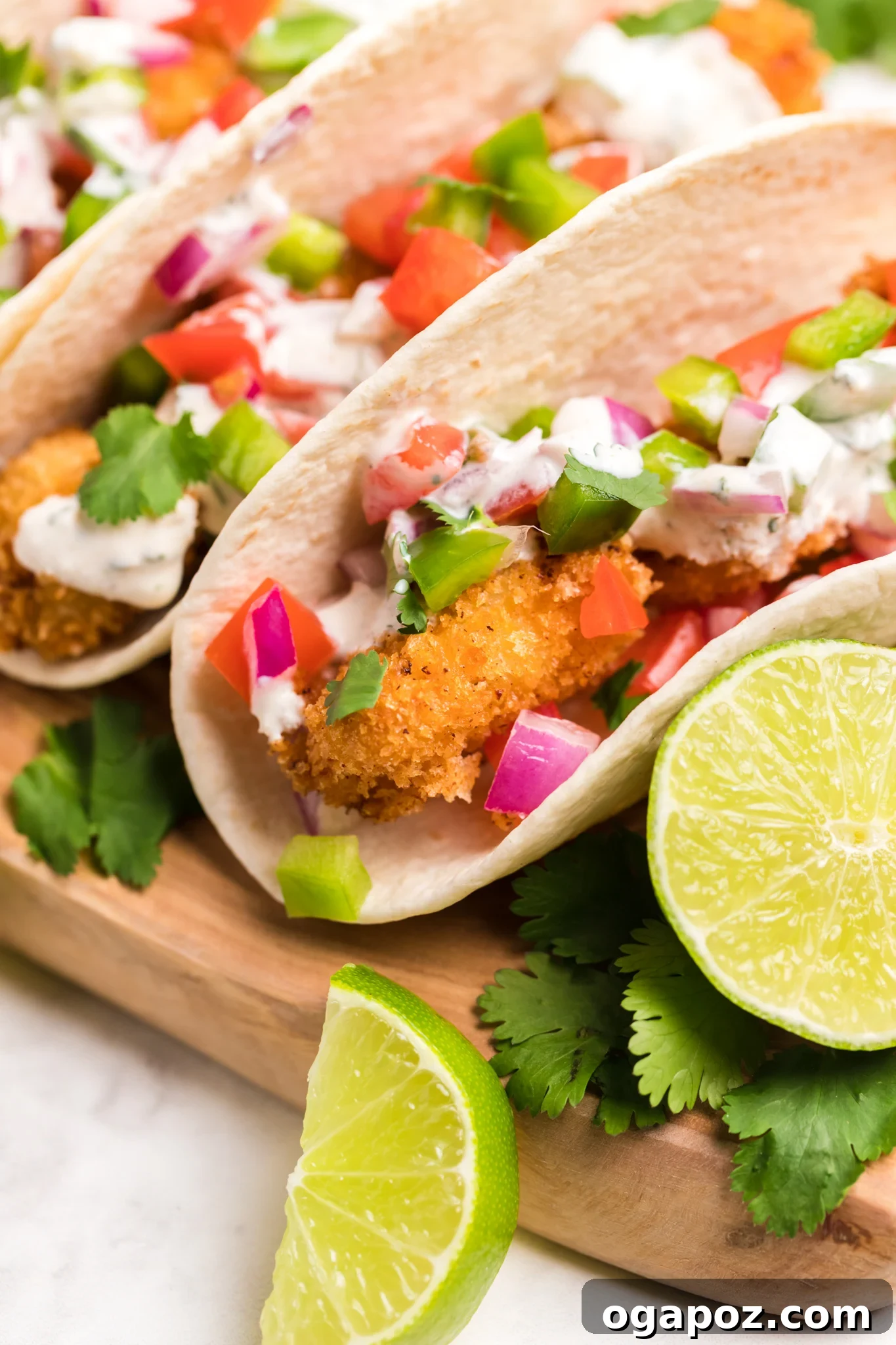 Crispy Air Fryer Tilapia 3 Air Fryer Tilapia served in tacos with fresh toppings.