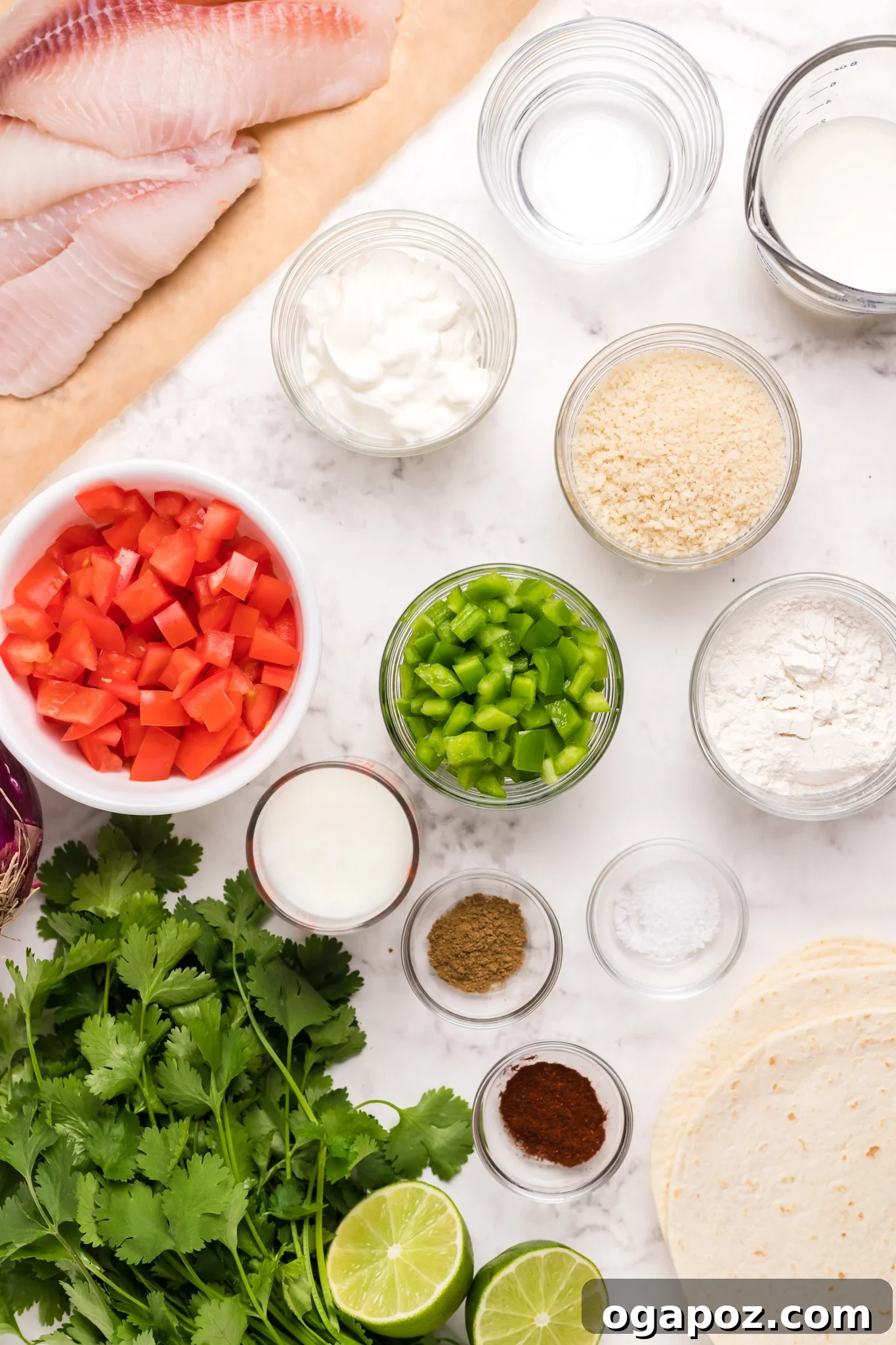 Zesty Tilapia Tacos 3 Ingredients laid out for Tilapia Fish Tacos, including tilapia fillets, tortillas, fresh herbs, and vegetables.