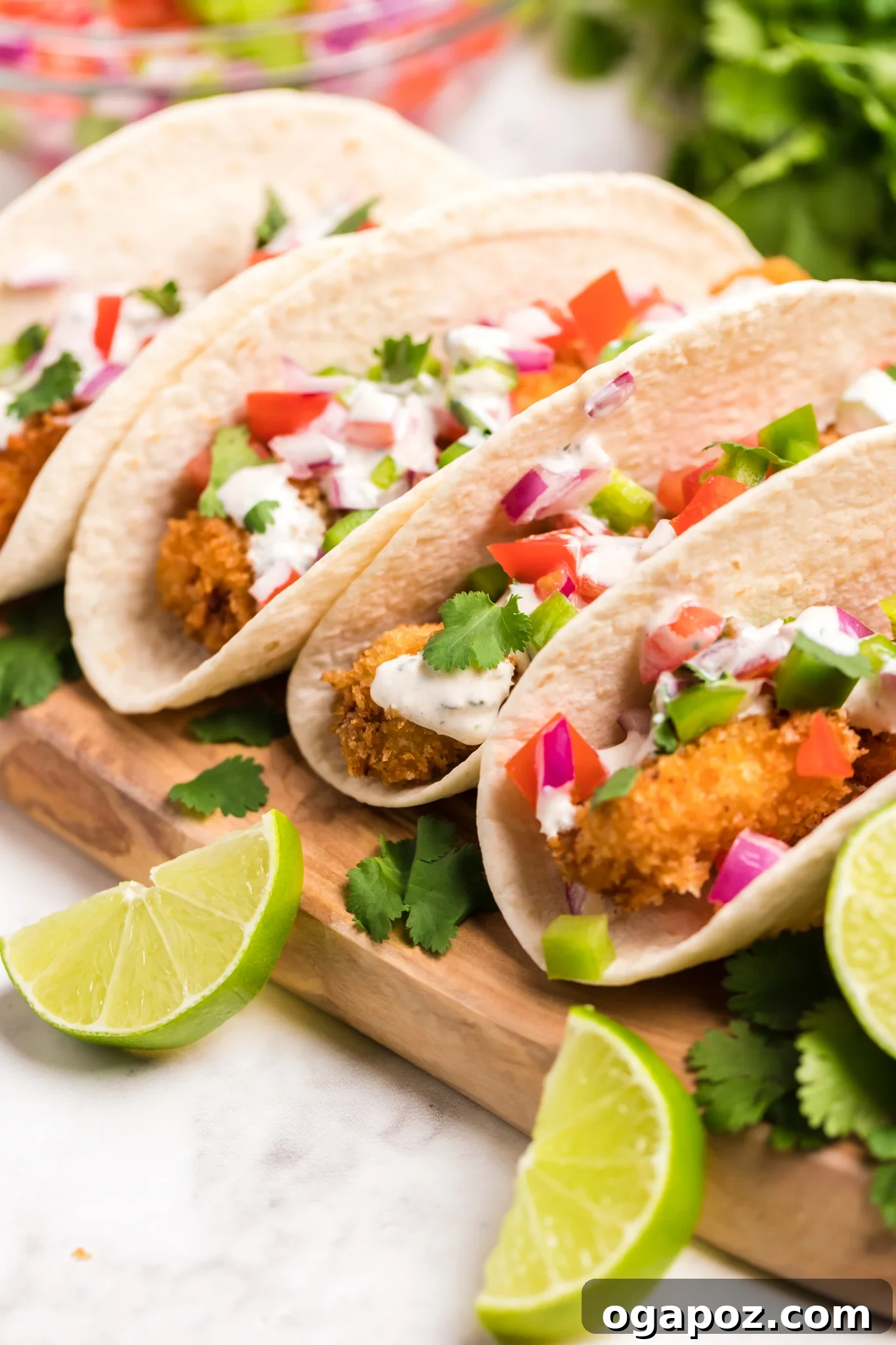 Zesty Tilapia Tacos 4 Assembled Tilapia Fish Tacos in warm corn tortillas, ready to be served.