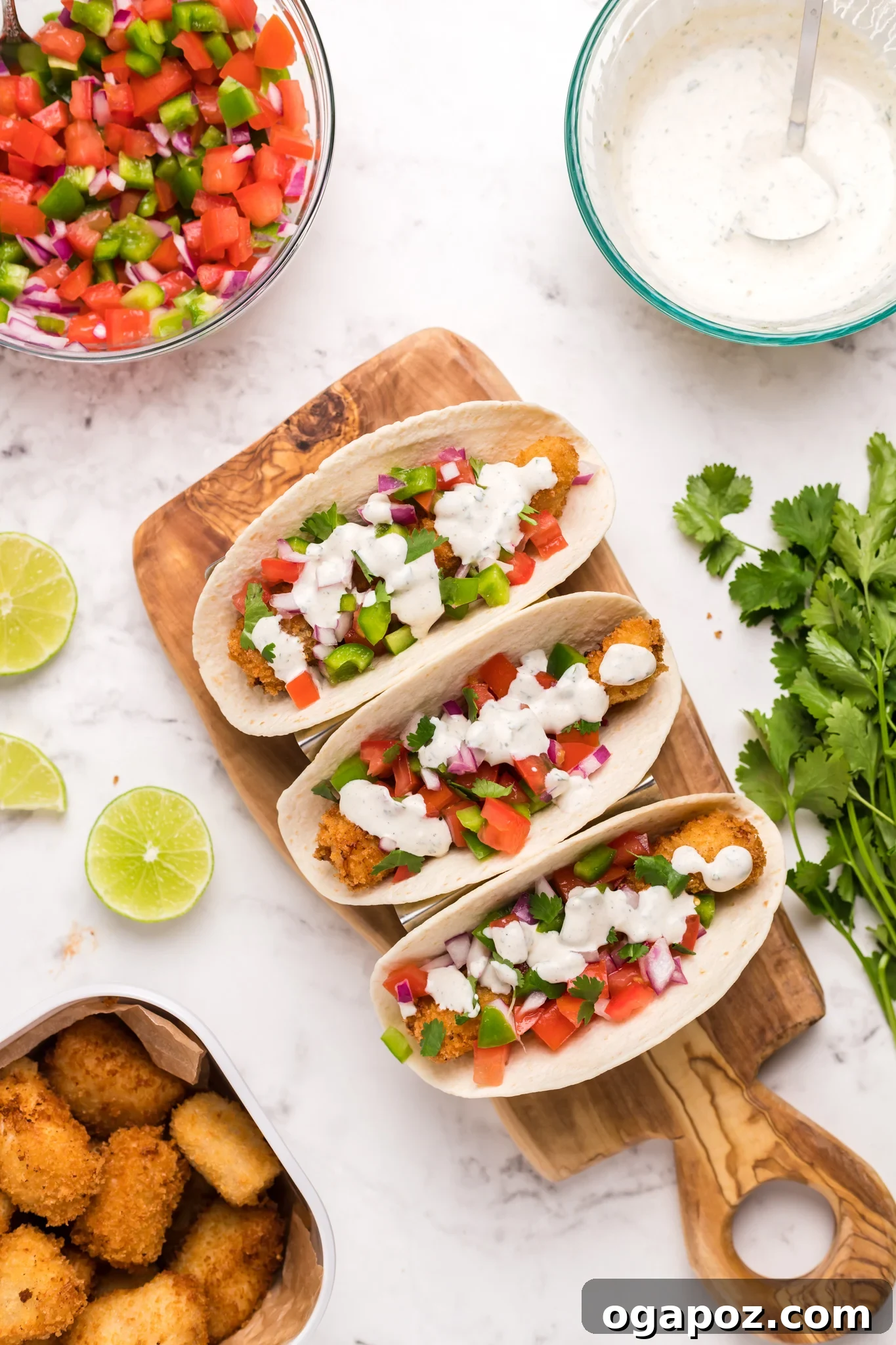 Zesty Tilapia Tacos 5 Tilapia Fish Tacos drizzled with creamy aioli and fresh cilantro.