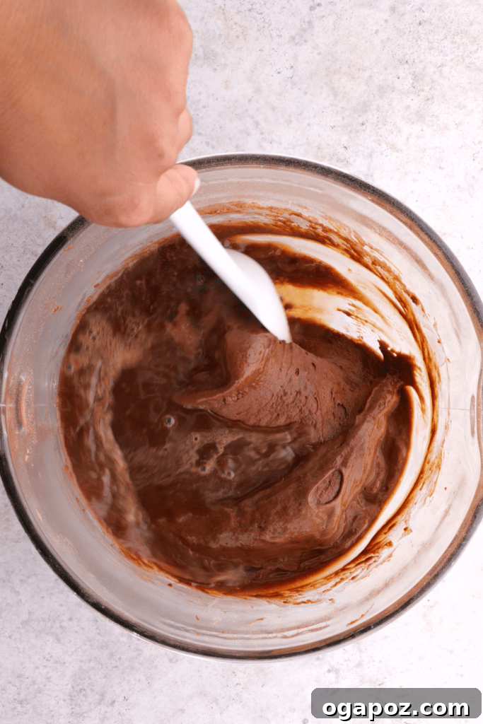 Perfect Christmas Yule Log Cake 4 Mixing the chocolate cake batter.