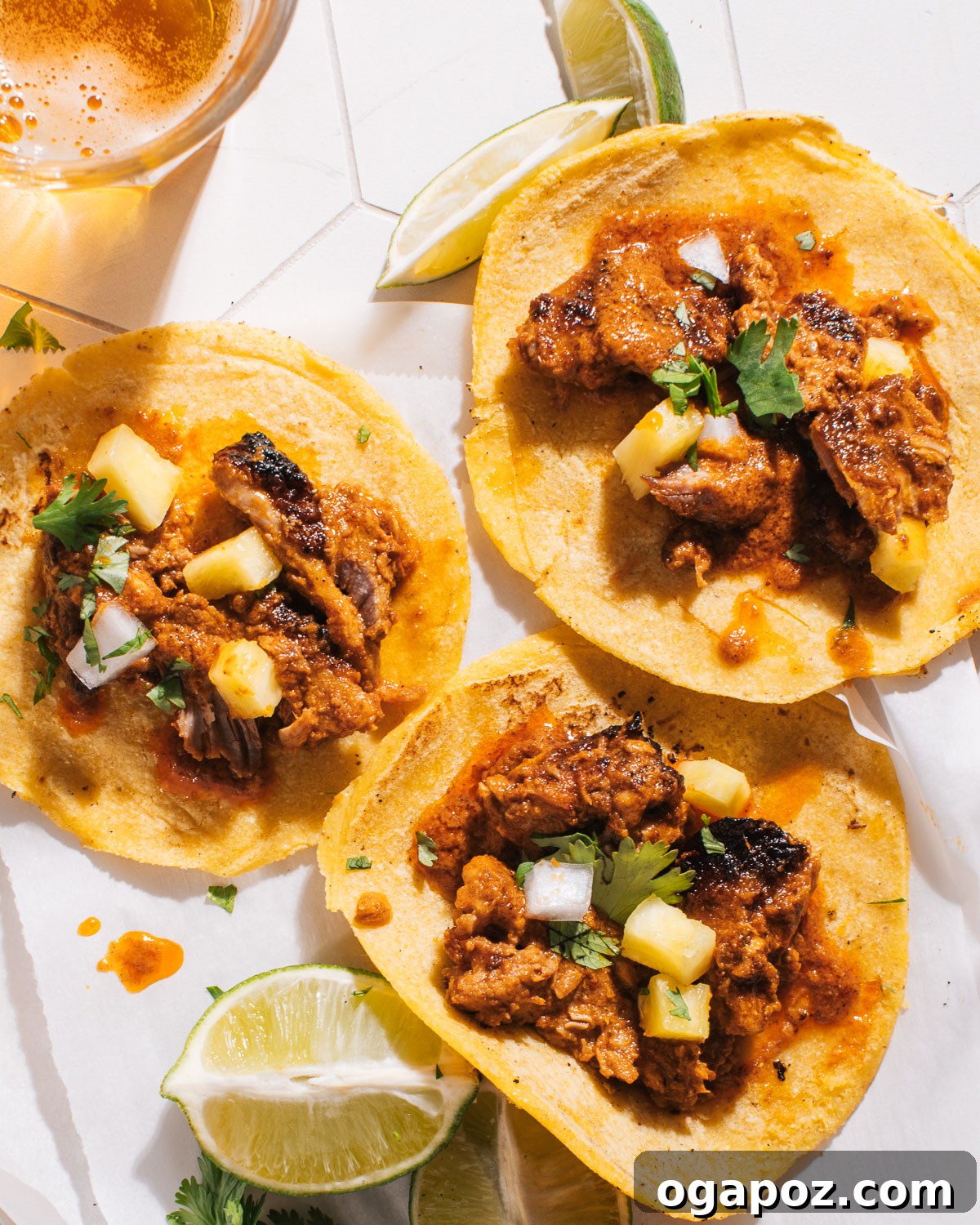 Effortless Tacos Al Pastor Recipe 8 Two Tacos Al Pastor with lime wedges and fresh toppings