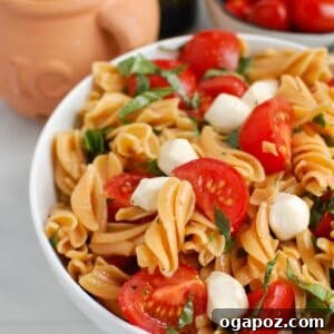 Caprese Pasta in a serving bowl, ready to be enjoyed.