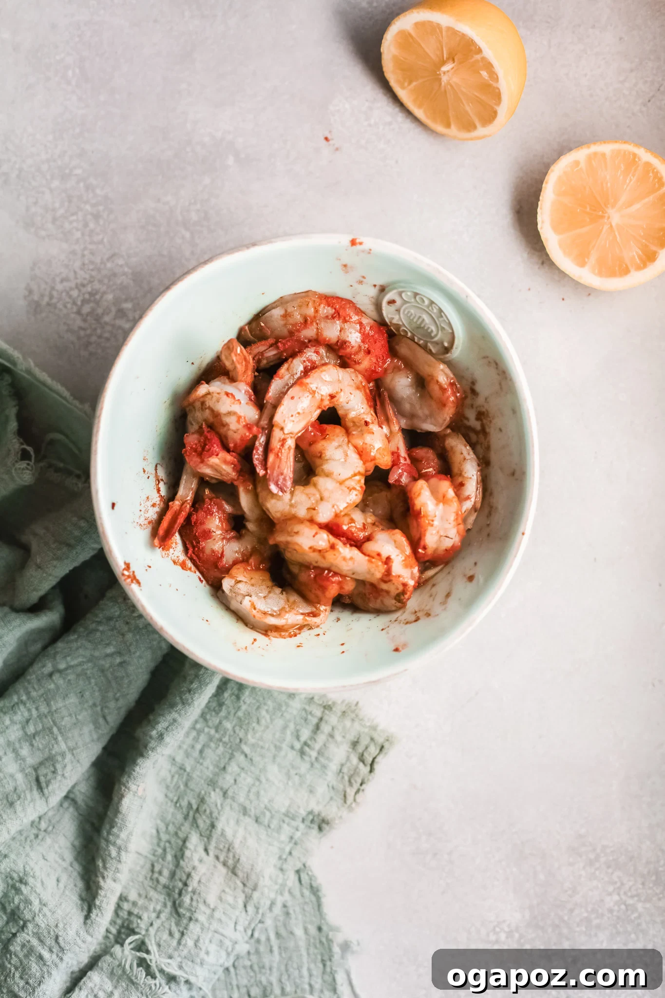 Spicy Southern Shrimp in Minutes 5 Raw shrimp seasoned generously with Cajun spices in a mixing bowl, ready for cooking.