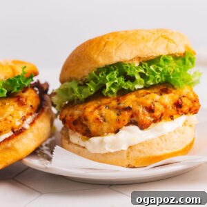 Turkey burger with lettuce and mayo on a plate.