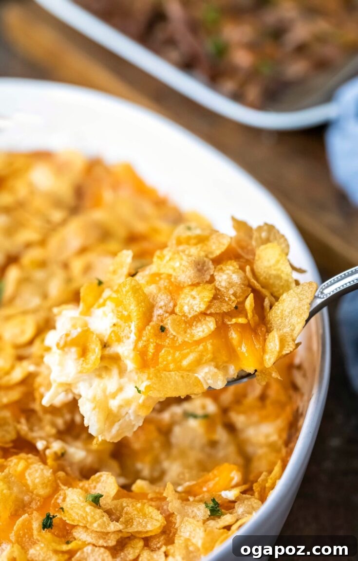 Cheesy Funeral Potatoes casserole with a crispy topping.