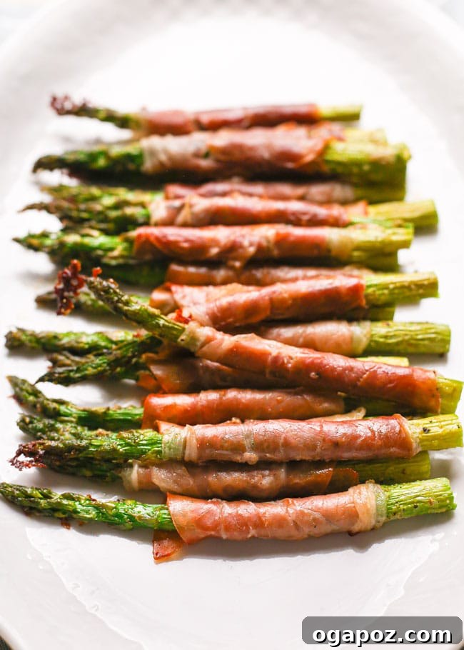Roasted asparagus spears wrapped in crispy prosciutto.