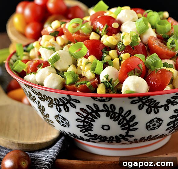 Sweet Corn Caprese Salad with cherry tomatoes, mozzarella, and basil.