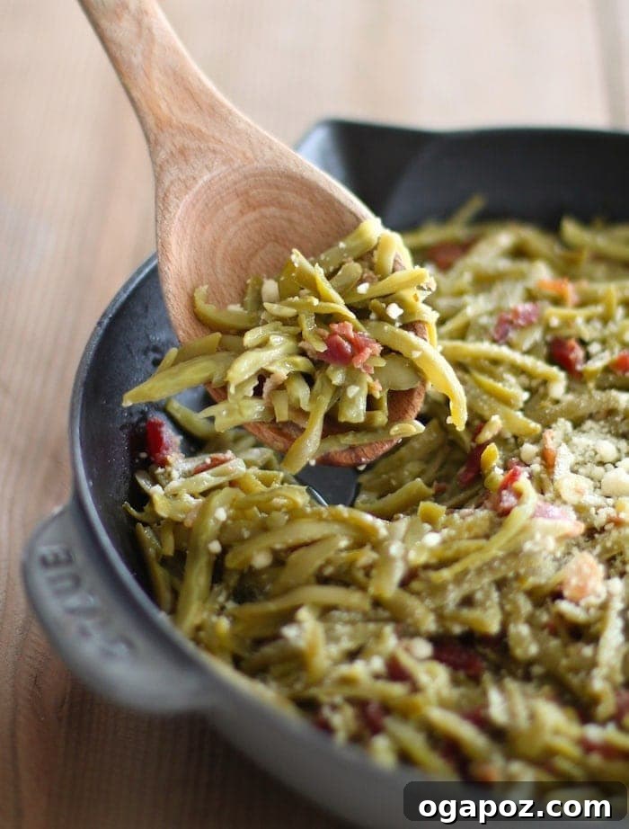 Sautéed green beans with crispy bacon bits and parmesan cheese.