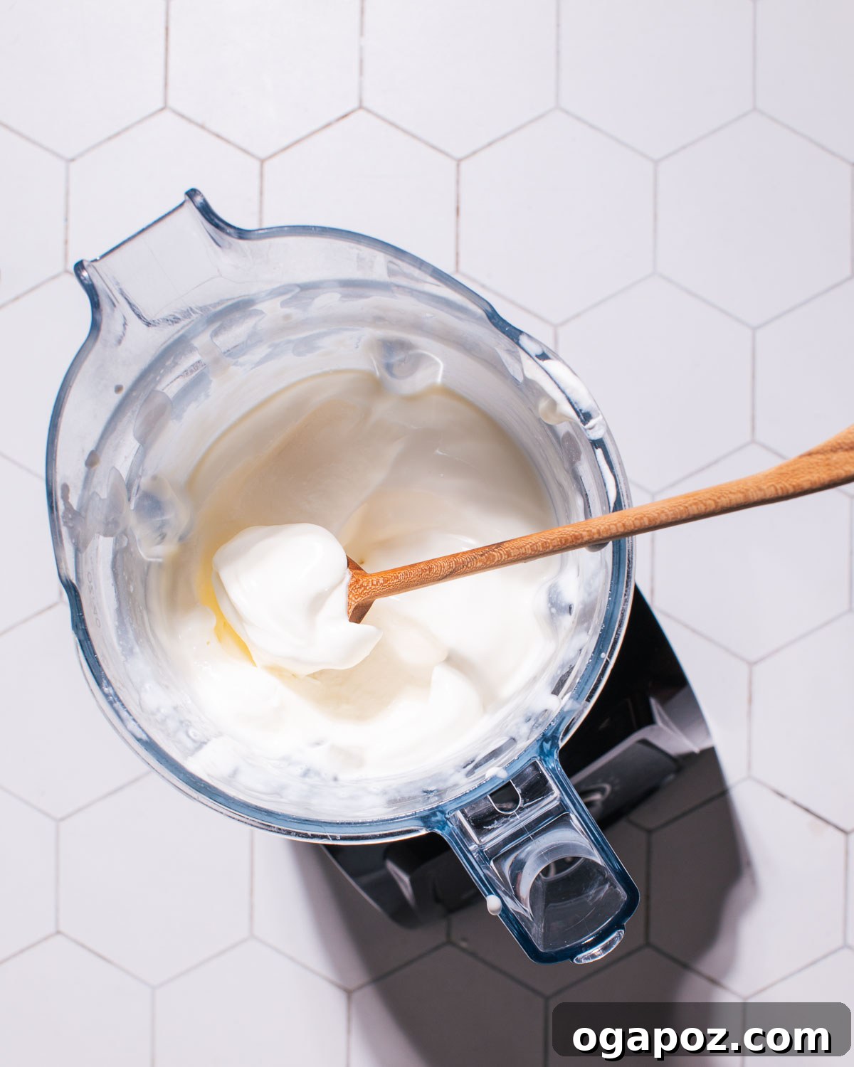 Effortless No Churn Cookies and Cream Ice Cream 6 Beautifully whipped cream in a blender, showing its fluffy, stiff-peak texture.