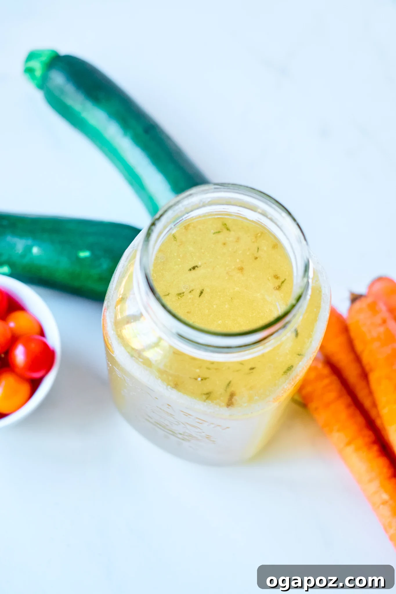 Nourishing Beef Bone Broth Made Simple 4 Easy Beef Bone Broth Recipe in a glass jar, ready for storage.