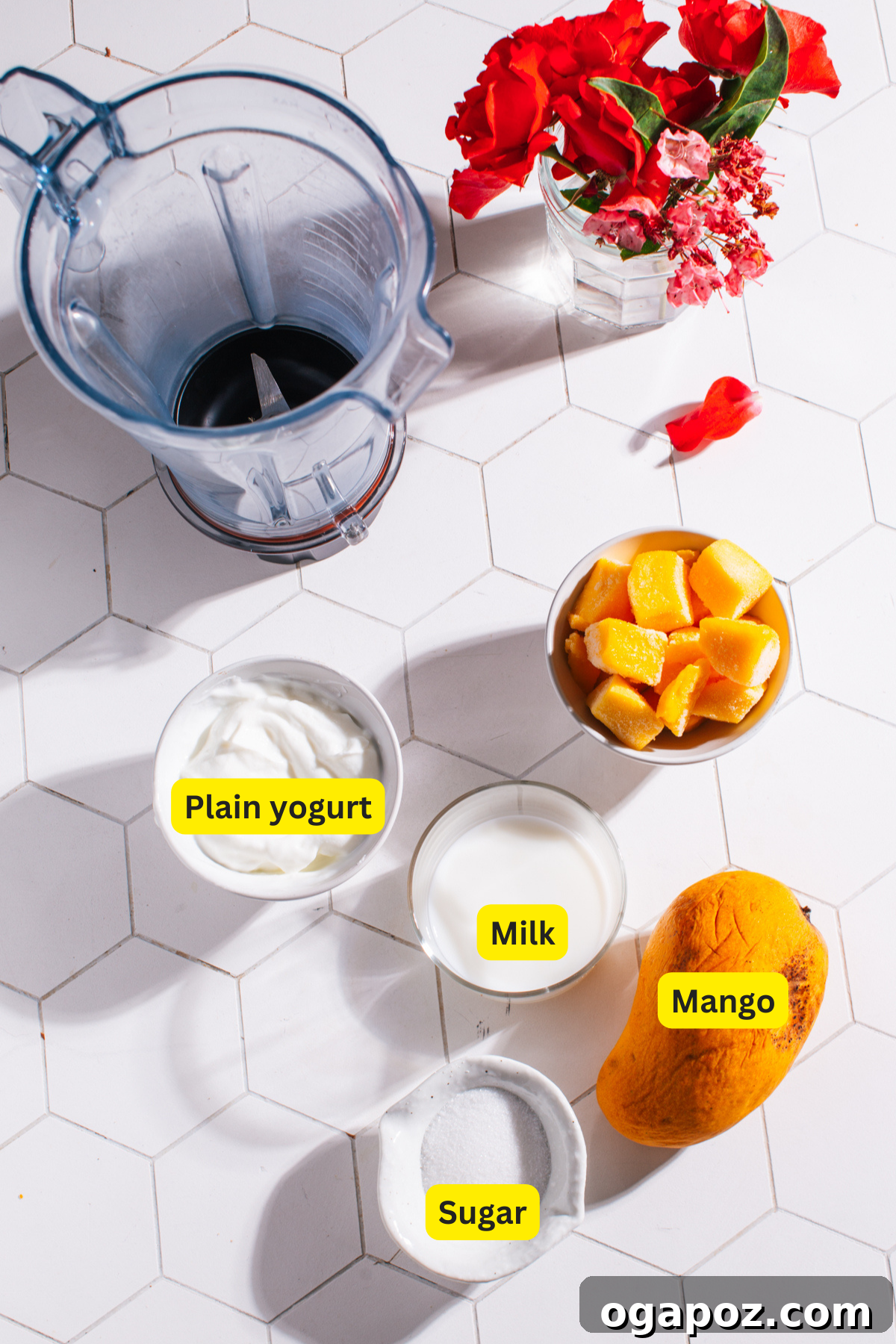Four key ingredients for a delicious Mango Lassi: mango, yogurt, milk, and sugar