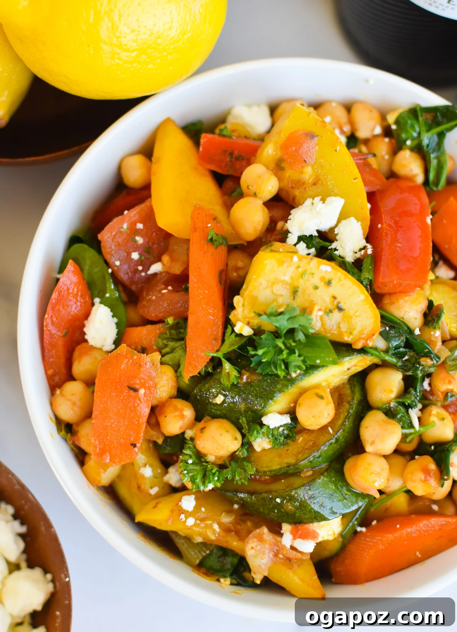 Vibrant Mediterranean Chickpea Skillet 4 Mediterranean Chickpea Skillet served elegantly in a white bowl, garnished and ready to be enjoyed.
