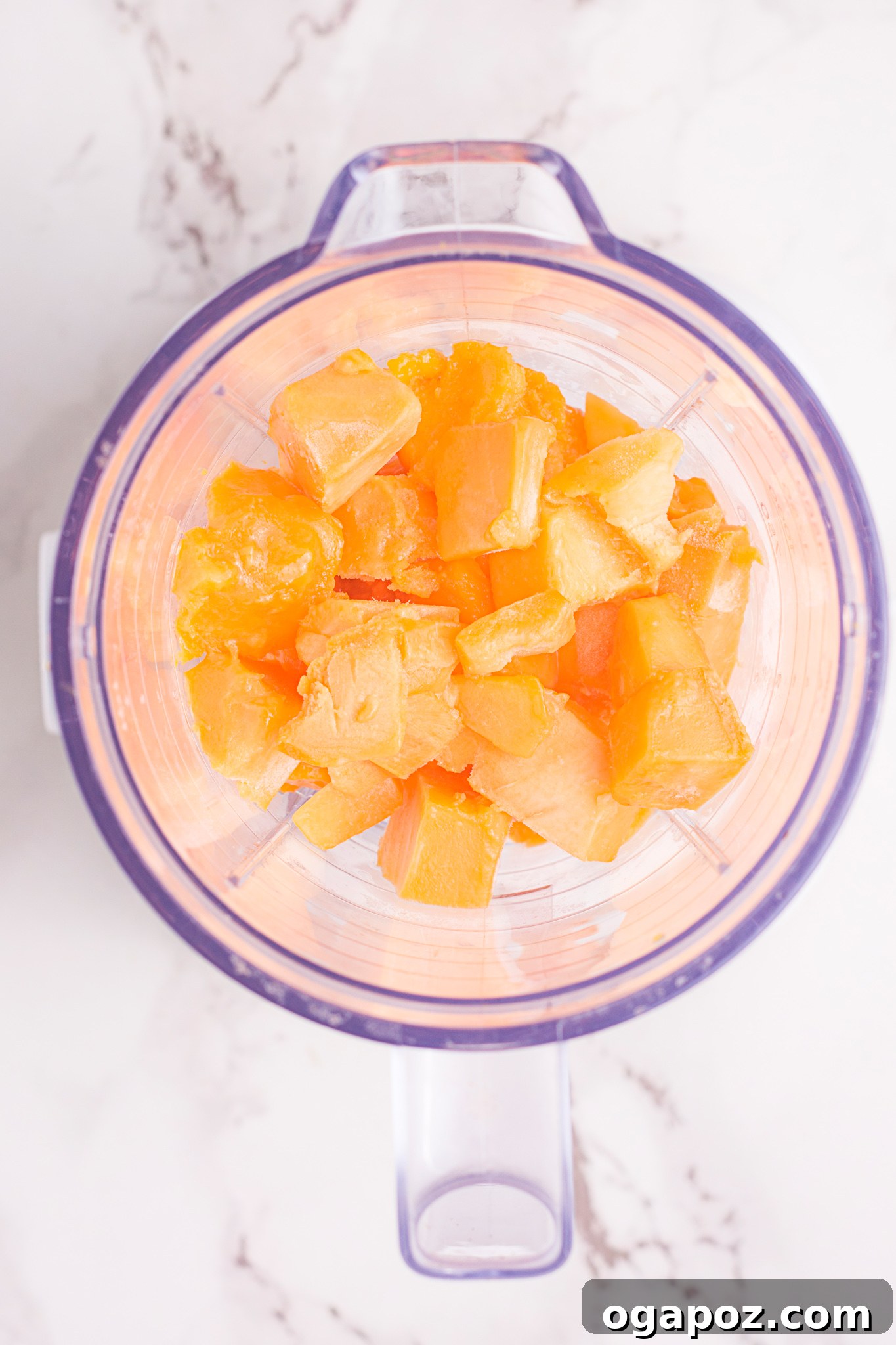 Velvety Mango Lassi 4 All ingredients for Mango Lassi being added into a high-speed blender for preparation.