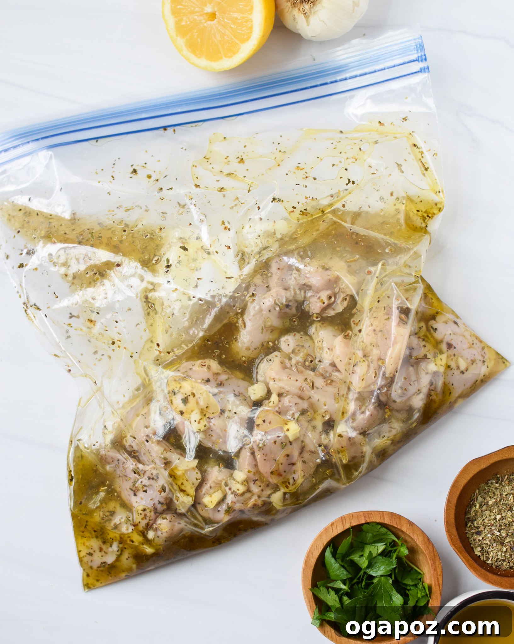 Classic Greek Chicken Souvlaki 6 Chicken Souvlaki pieces marinating in a Ziploc bag with lemon, oil, and herbs.