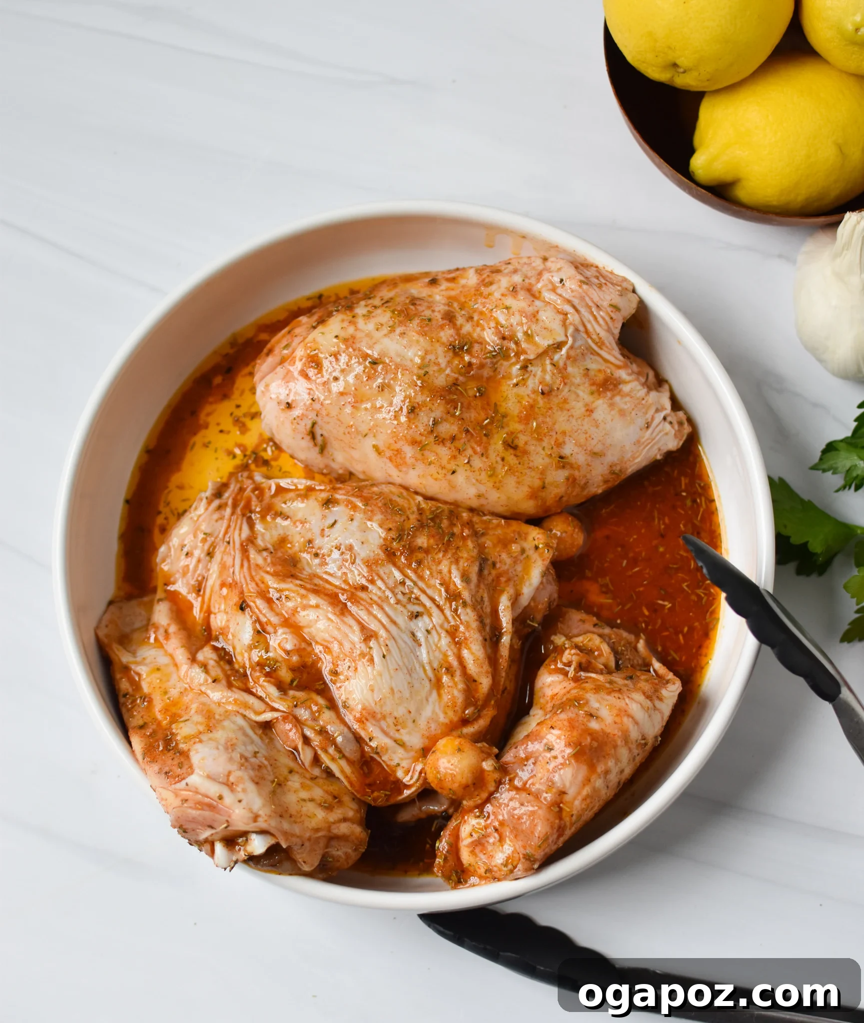 Zesty Mediterranean Air Fryer Chicken Thighs 5 Marinated Air Fryer Mediterranean Chicken Thighs resting in a bowl, ready for cooking.