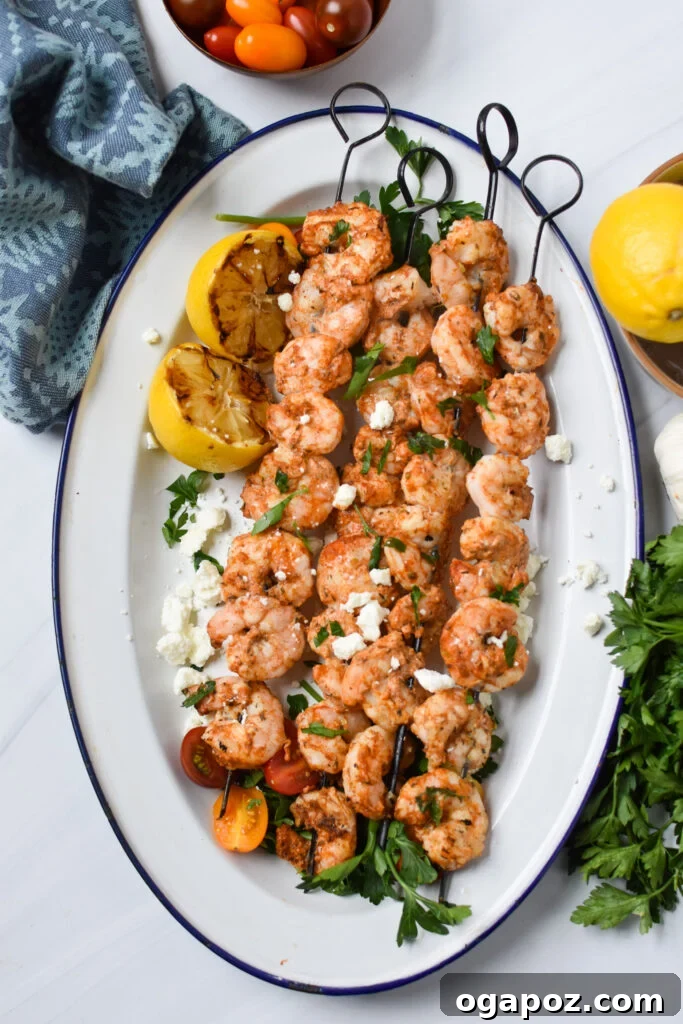 Zesty Mediterranean Grilled Shrimp Skewers 6 Close-up of Mediterranean Grilled Shrimp Skewers on a white plate, ready to be enjoyed.
