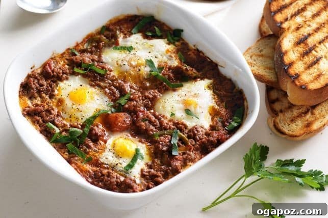 26+ Meat Sauce Masterpieces Delicious Dinners and Effortless Encore Meals 9 Baked Eggs in Meat Sauce with fresh herbs