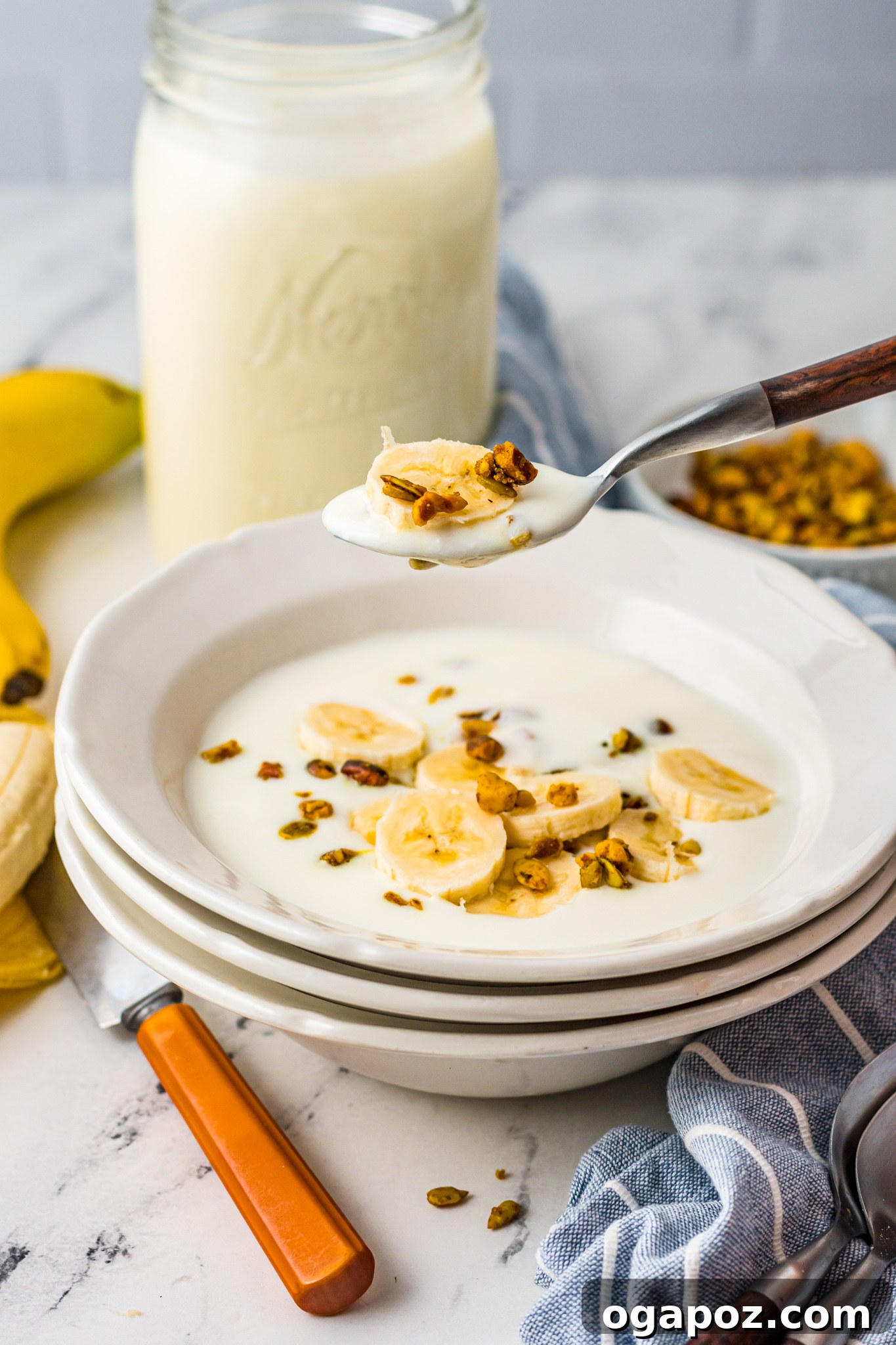 Creamy Homemade Instant Pot Yogurt 4 Instant Pot Yogurt Recipe with spoon over bowl.