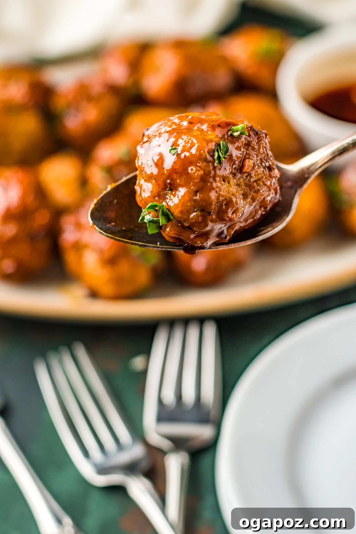 Crispy Air-Fried Meatballs 4 A single Air Fryer Meatball held on a spoon, showcasing its perfect texture.