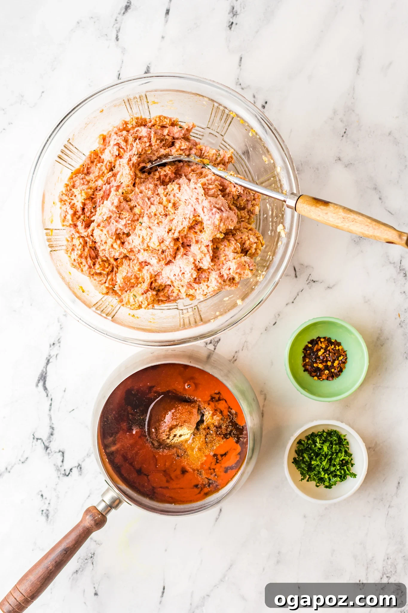 Crispy Air-Fried Meatballs 6 Cooked Air Fryer Meatballs in a serving dish, coated in the spicy sauce.