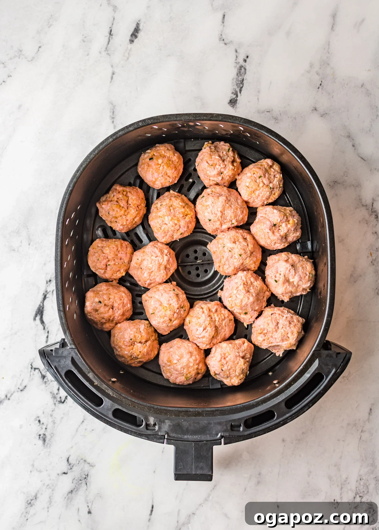 Crispy Air-Fried Meatballs 7 Air Fryer Meatballs cooking inside the air fryer basket.