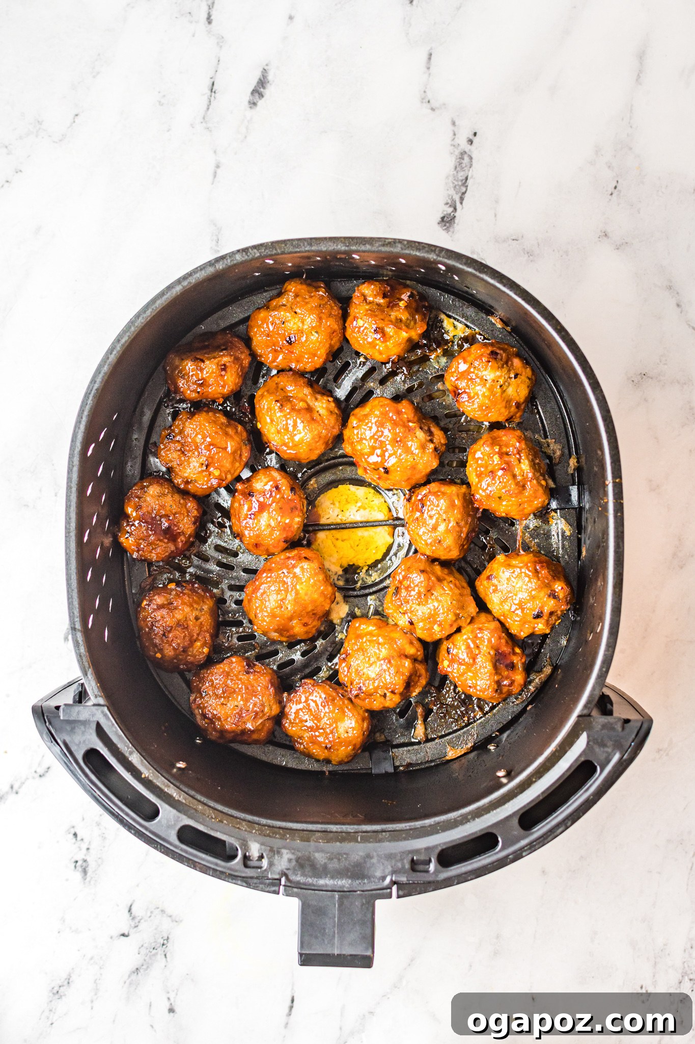 Crispy Air-Fried Meatballs 8 A basket full of Air Fryer Meatballs, freshly cooked and ready to be sauced.