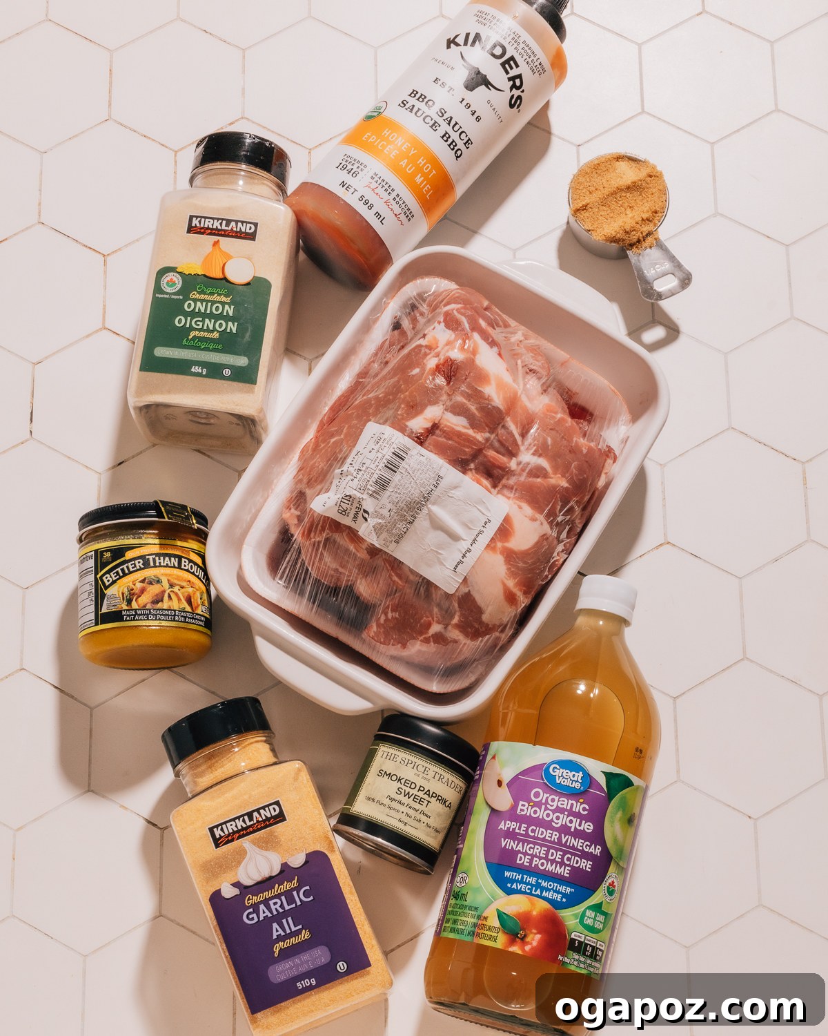 Melt in Your Mouth Instant Pot Pulled Pork 3 A collection of ingredients for Instant Pot Pulled Pork, including pork, spices, and liquids.