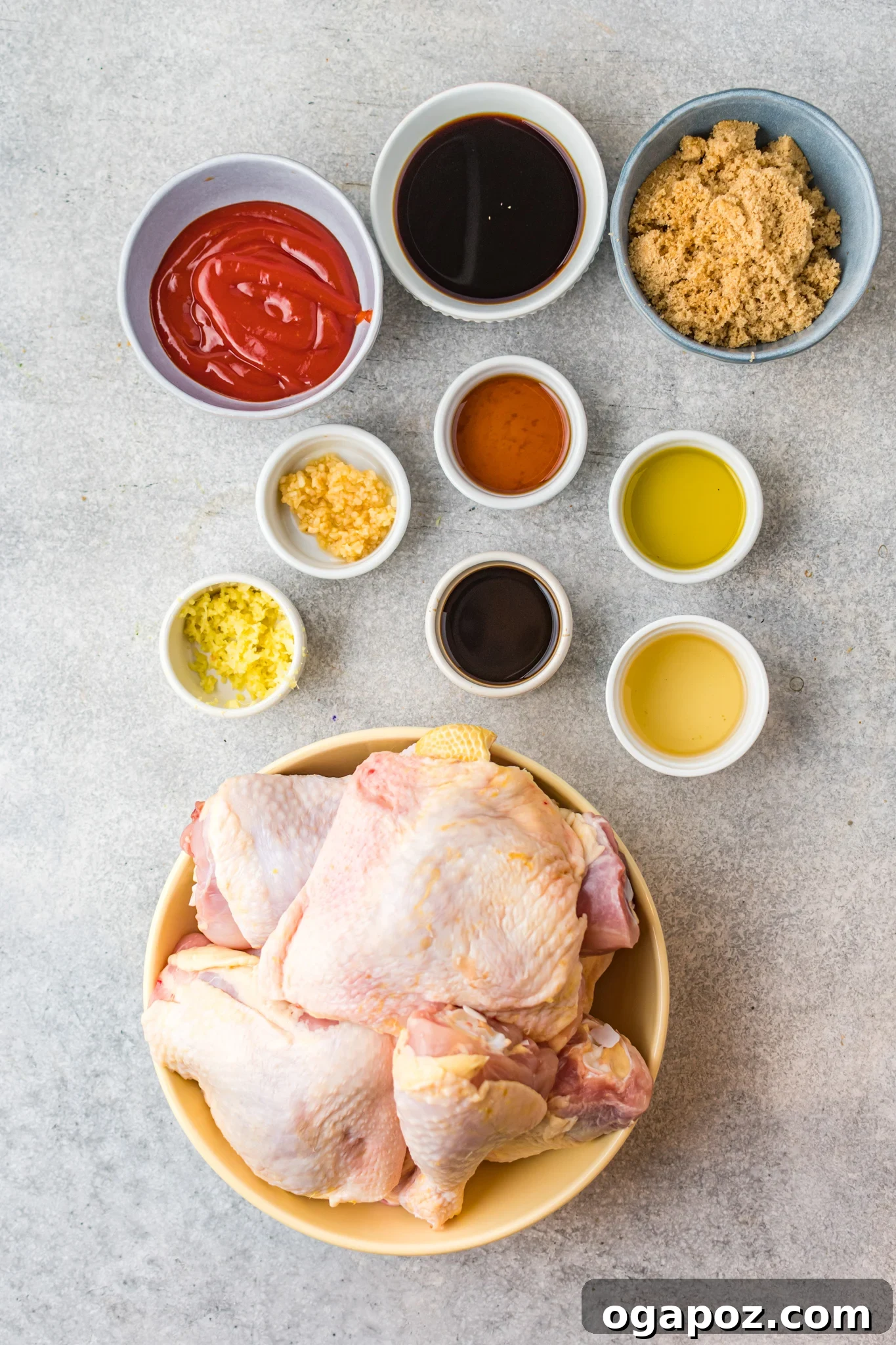 All the fresh ingredients laid out for making Grilled Huli Huli Chicken, including chicken pieces, sauces, and aromatics.