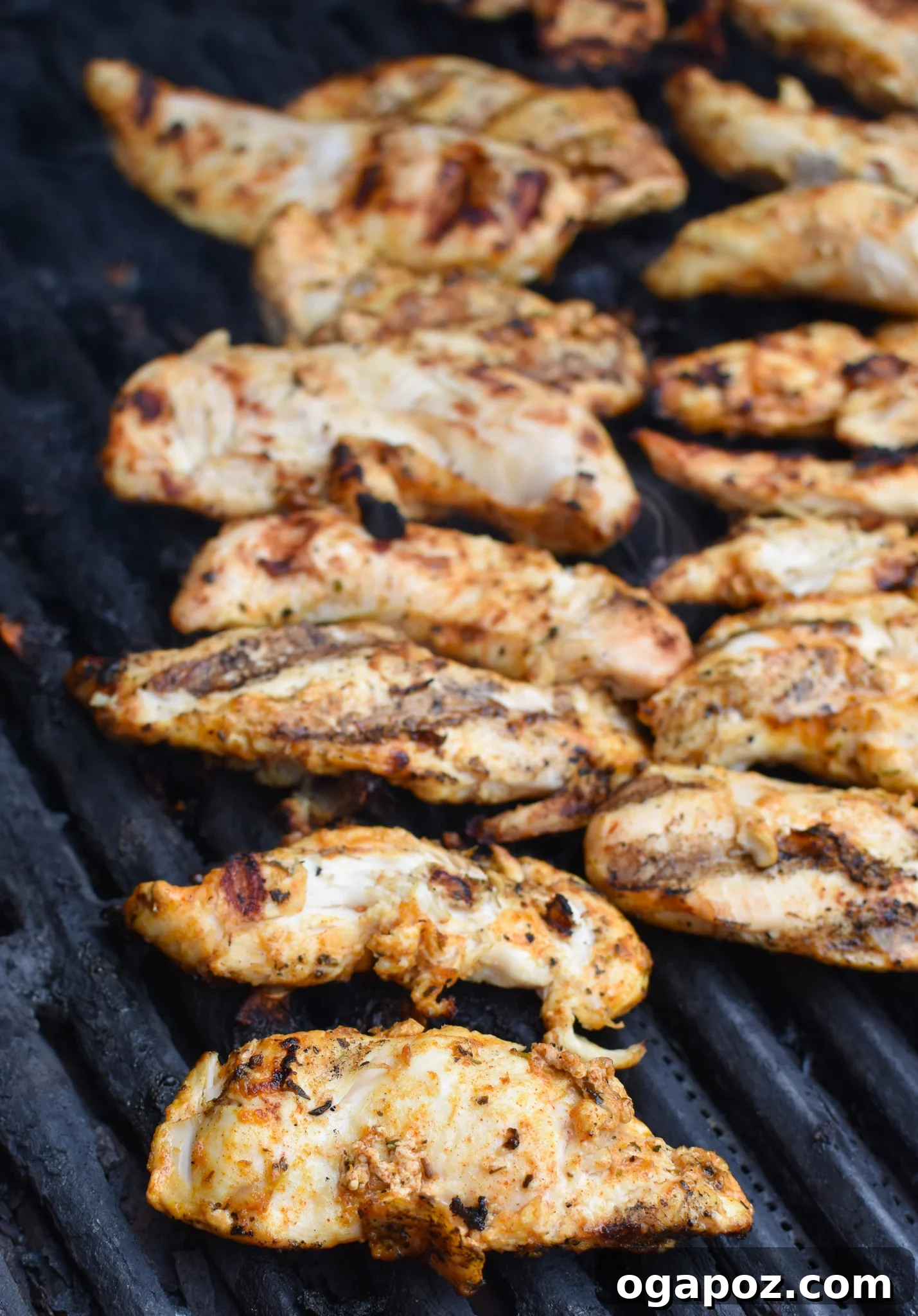 Tangy Yogurt Chicken 6 Yogurt Marinated Chicken cooking on a hot grill with grill marks visible.