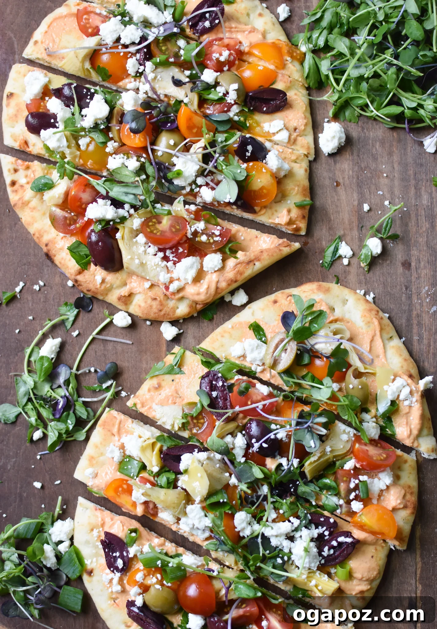 Sun-Kissed Mediterranean Naan Pizza 6 Mediterranean Naan Bread Pizza garnished with plenty of fresh micro greens.