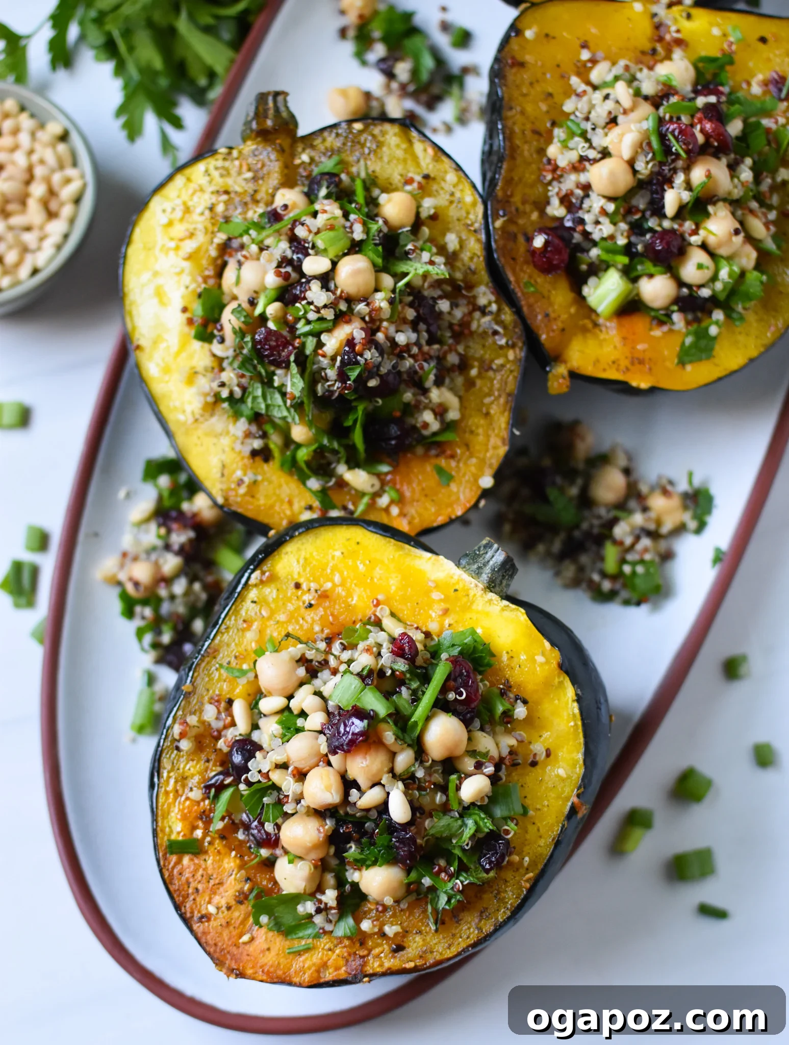 Sun-Kissed Mediterranean Stuffed Acorn Squash 6 Mediterranean Stuffed Acorn Squash on a white plate, ready to be served.