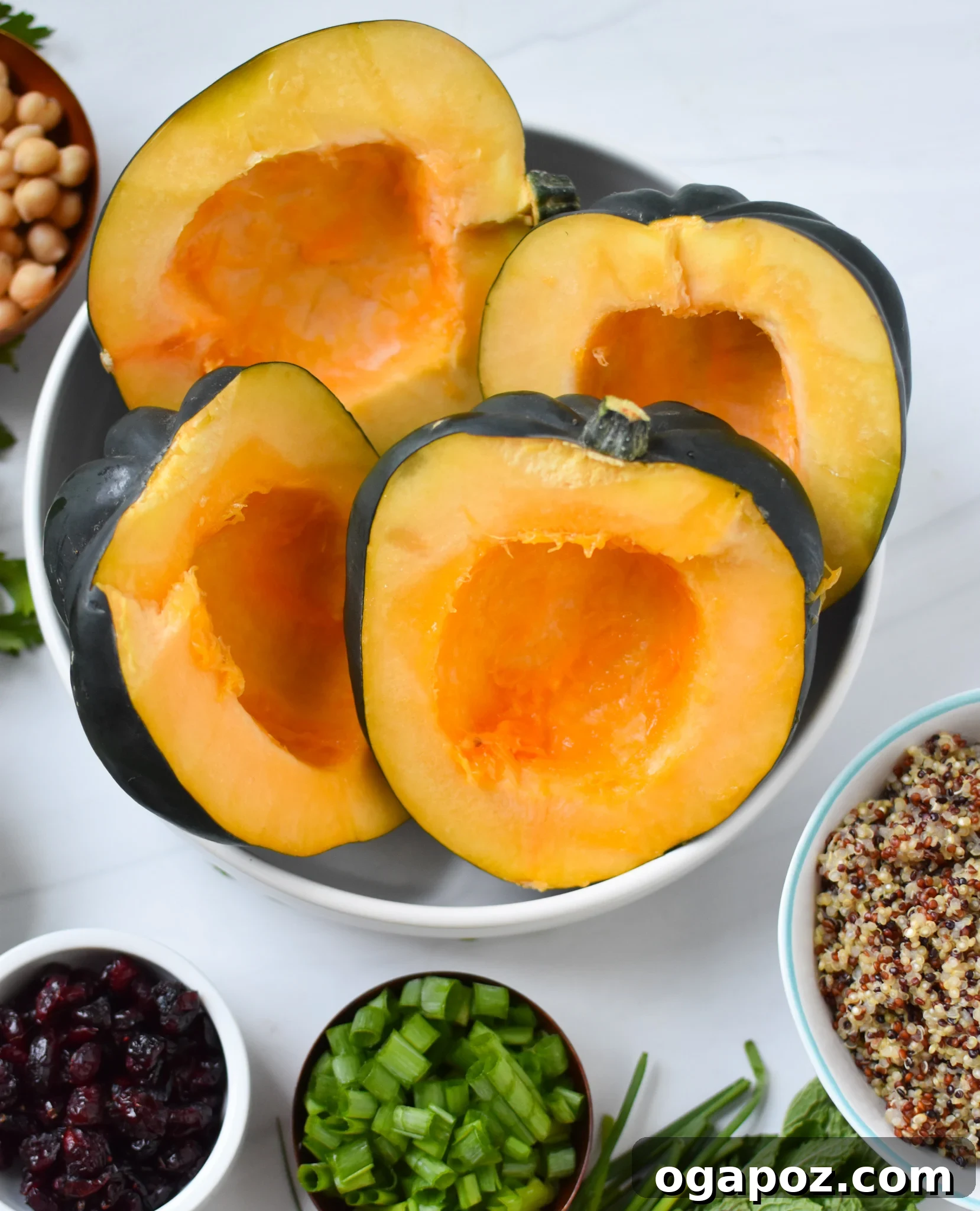 Sun-Kissed Mediterranean Stuffed Acorn Squash 7 Acorn squash cut in half and placed in a bowl, ready for prep.
