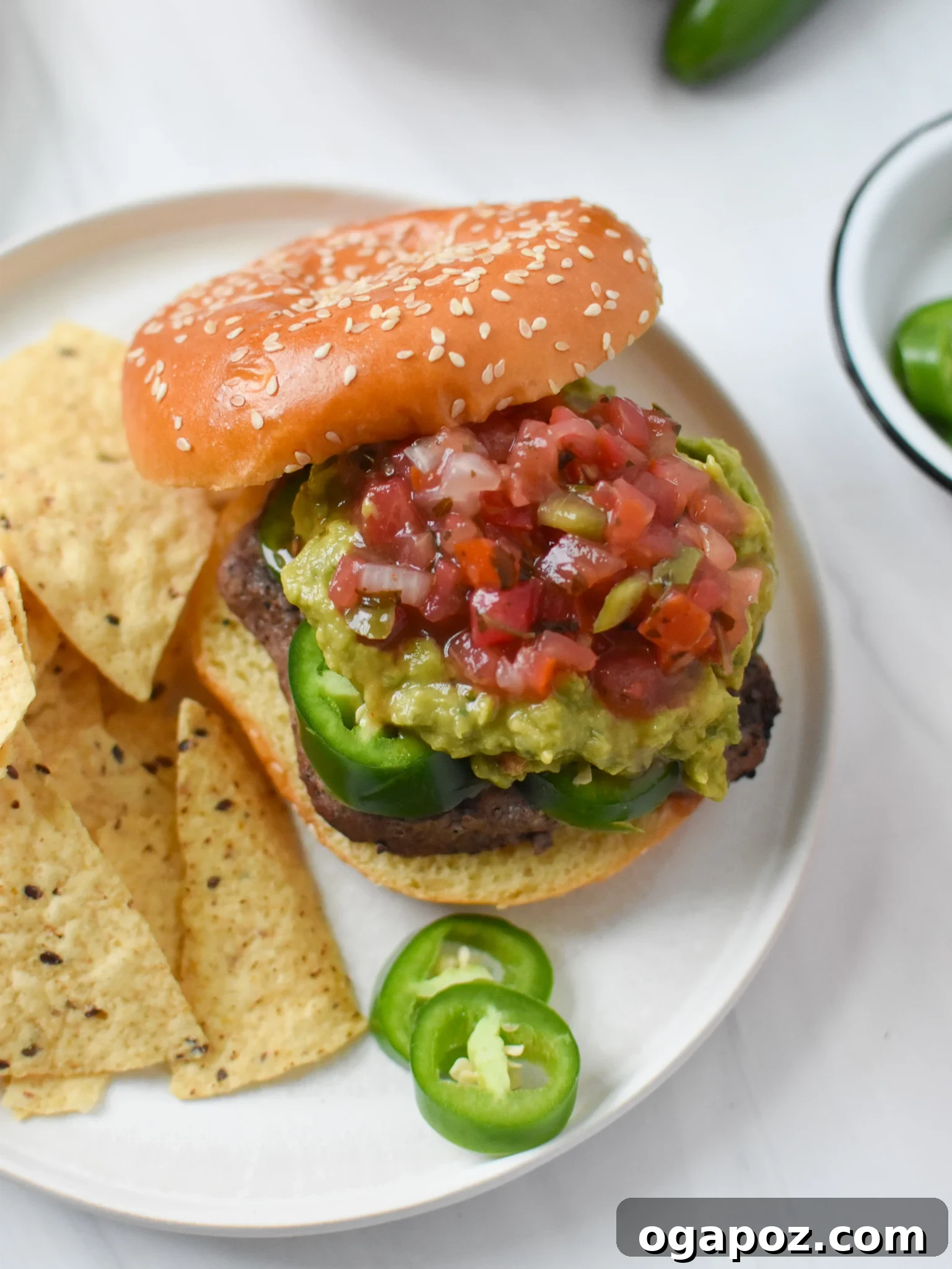 Tex Mex Fiesta Burger 3 Close-up of a Tex Mex Burger showcasing fresh jalapeños and toppings.