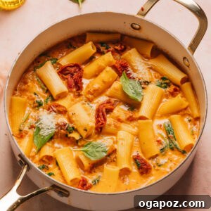 Tuscan Chicken Pasta in a saucepan.