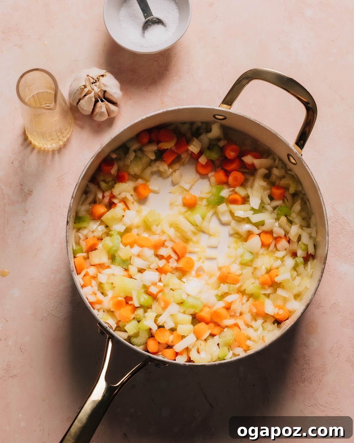 Perfectly Easy Homemade Chicken Noodle Soup 4 Sautéing onions, celery, and carrots in olive oil in a large pot.