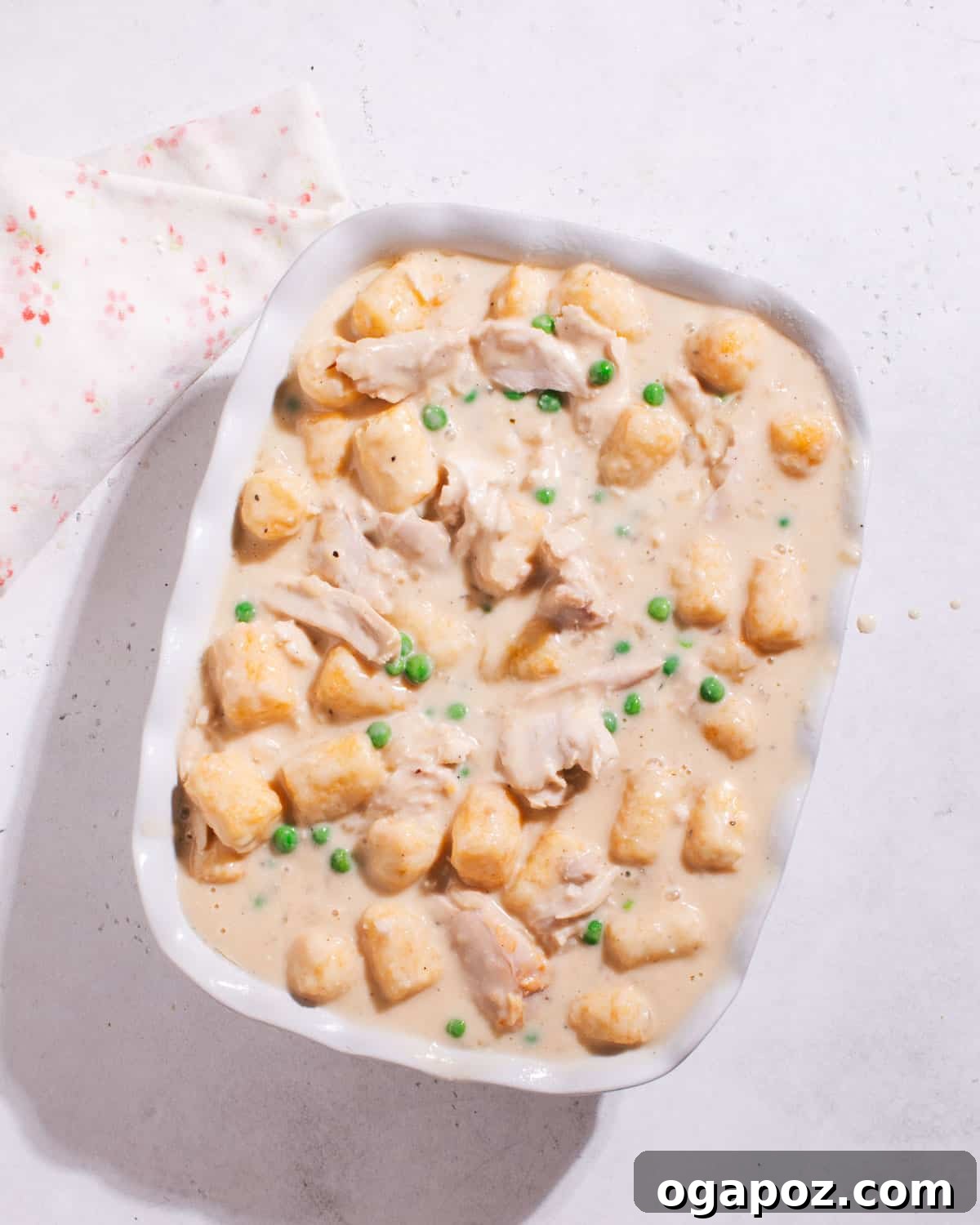 Quick and Scrumptious Chicken Tater Tot Casserole 7 Unbaked Chicken Tater Tot Casserole, ready for the oven with its layer of tater tots on top.