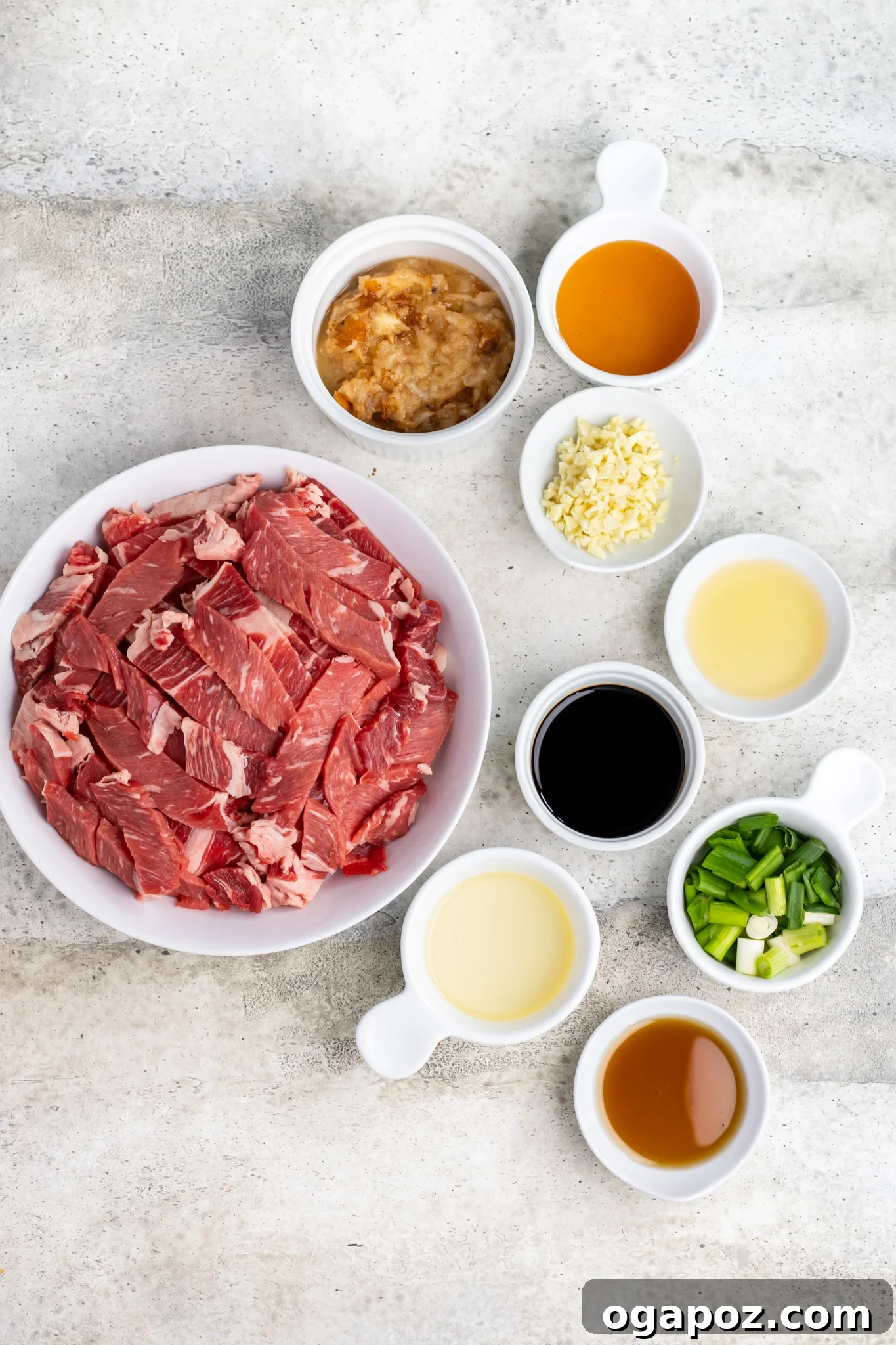 Savory Bulgogi Zucchini Ribbons 5 A selection of fresh ingredients including thinly sliced beef, grated pear, green onions, garlic, and sauces for Beef Bulgogi.
