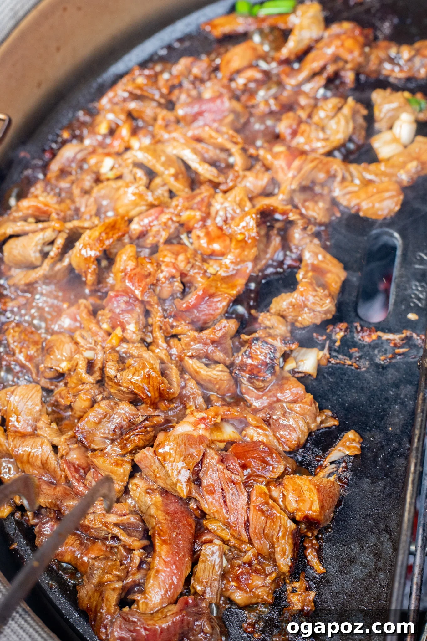 Savory Bulgogi Zucchini Ribbons 8 Thinly sliced beef bulgogi grilling on a barbecue, showing the delicious caramelization and quick cooking process.